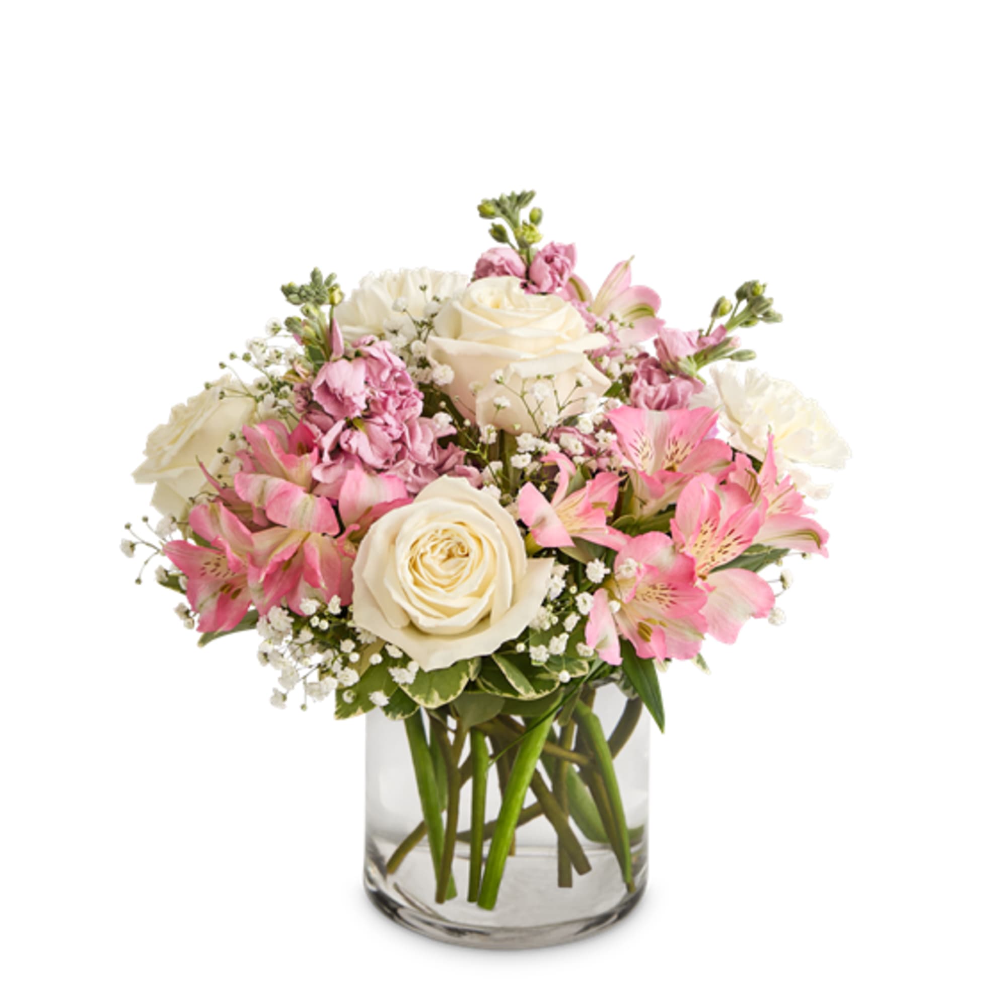 Pink and white flower bouquet in a clear glass vase