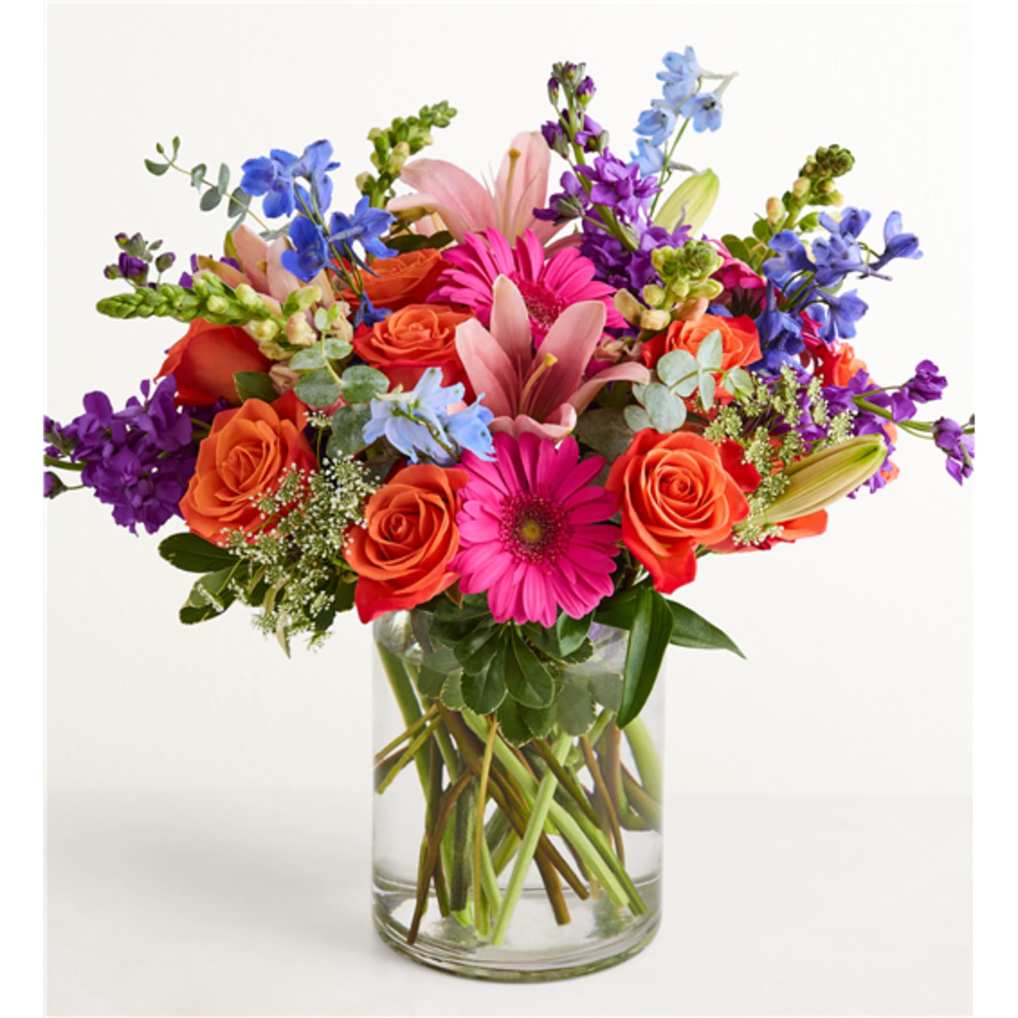Colorful mixed bouquet in a clear glass vase