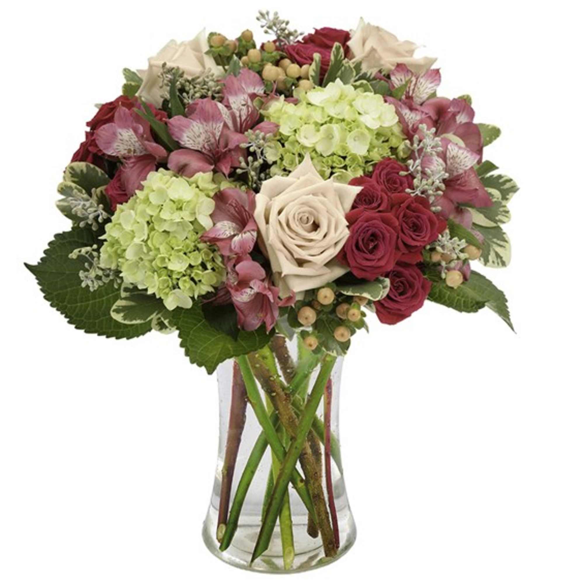 Pink and cream mixed bouquet in a clear glass vase