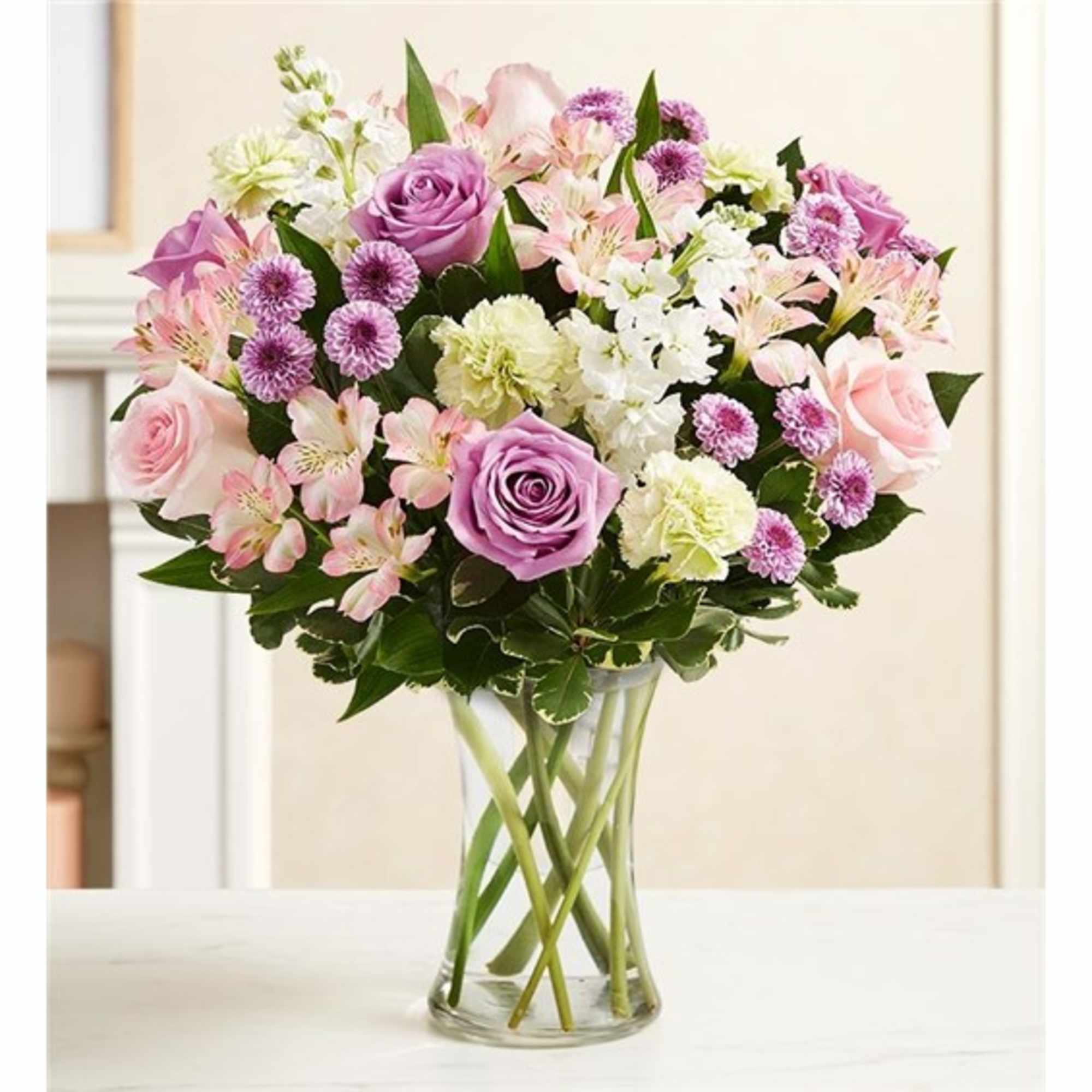 Pink and lavender mixed bouquet in a clear glass vase