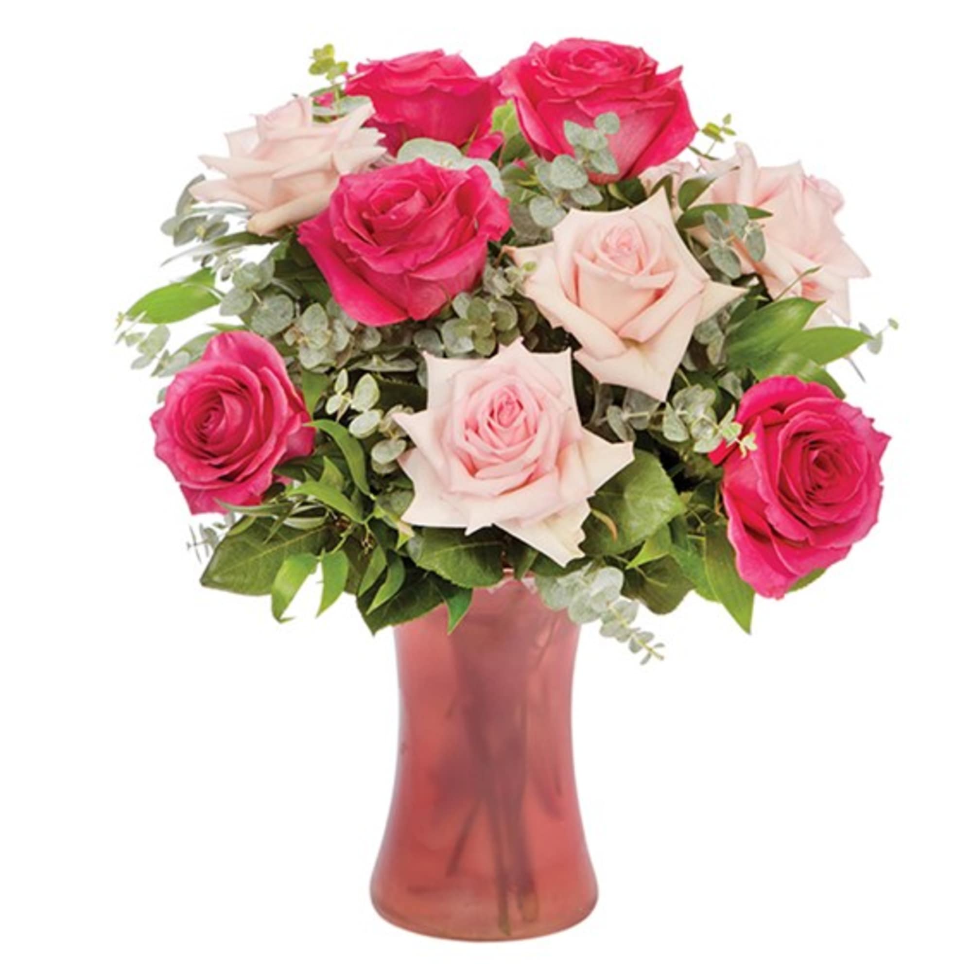 Bouquet of pink and pale blush roses in a pink glass vase