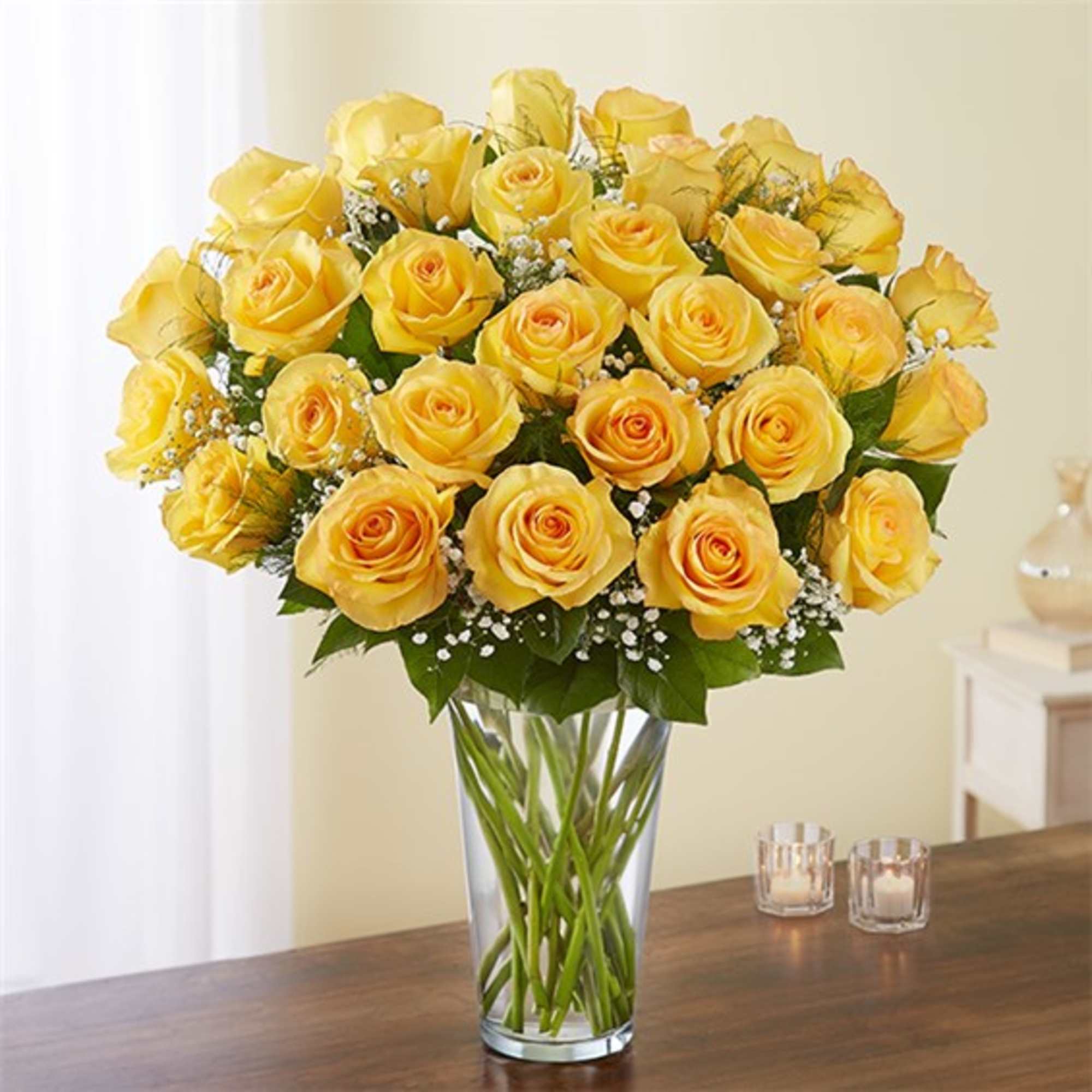 Bouquet of yellow roses in a clear glass vase