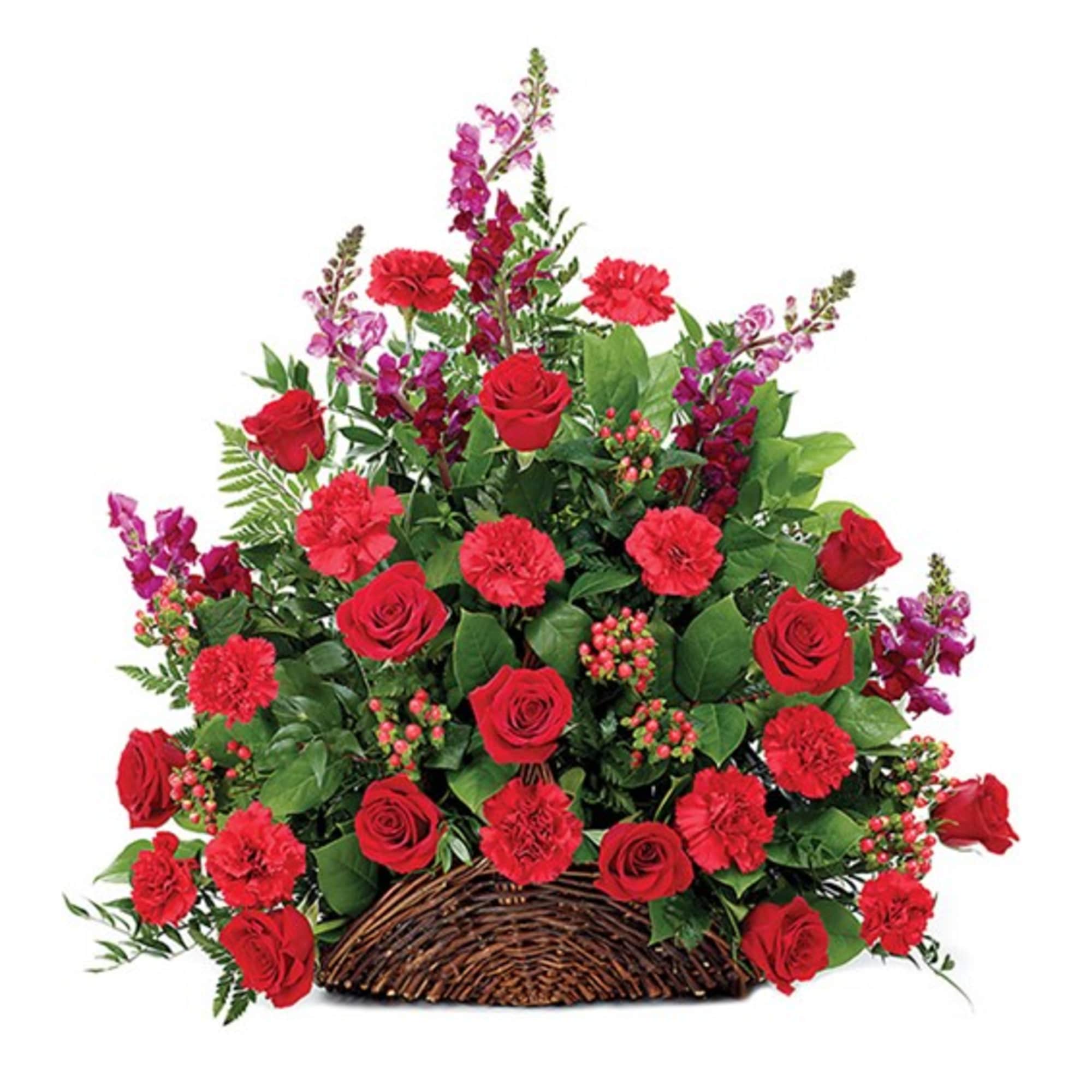 Red roses and carnations arranged in a wicker basket with purple accent flowers