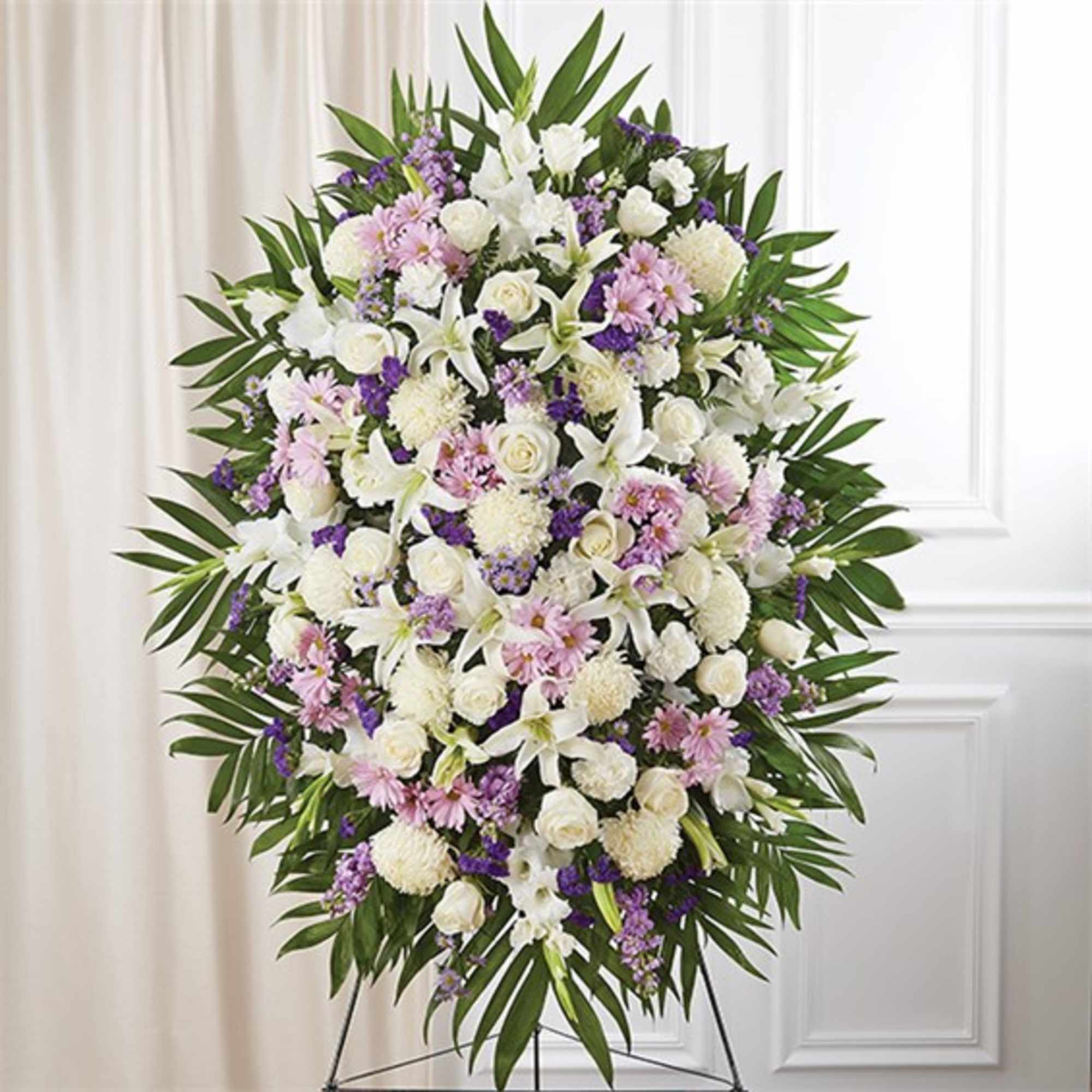 Large standing floral spray with white, pink, and purple flowers