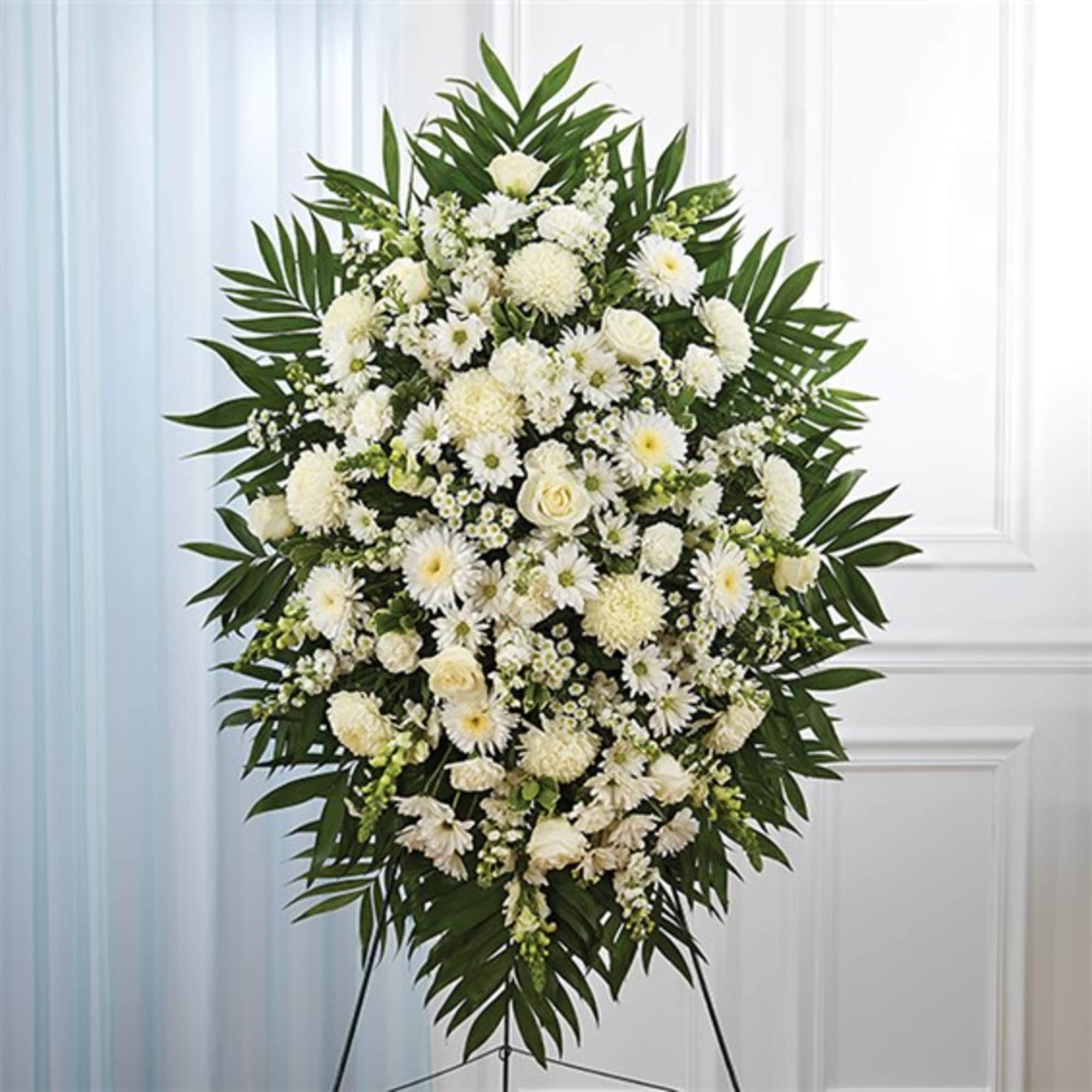 Standing white floral spray on a tripod easel