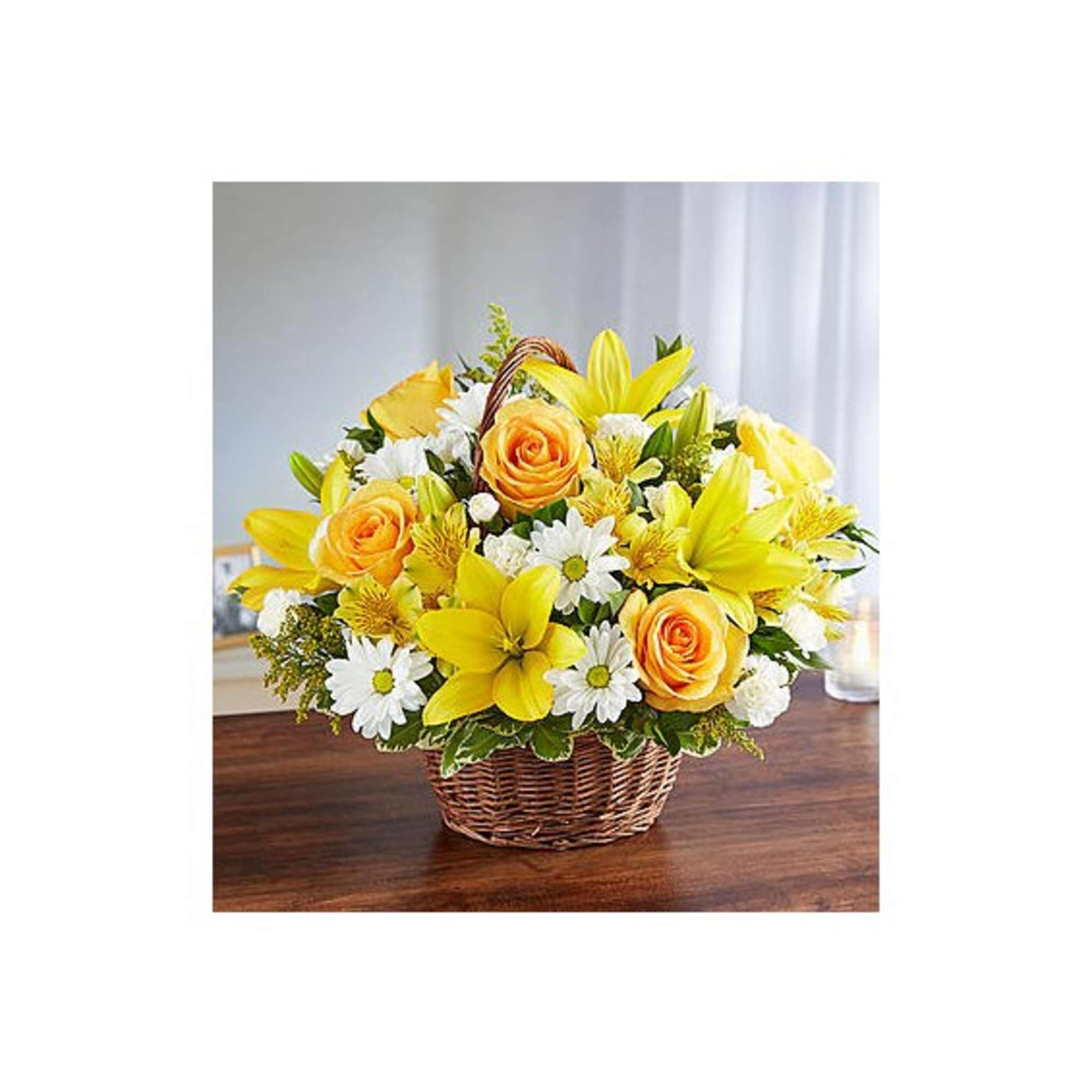 Yellow and white flower arrangement in a wicker basket