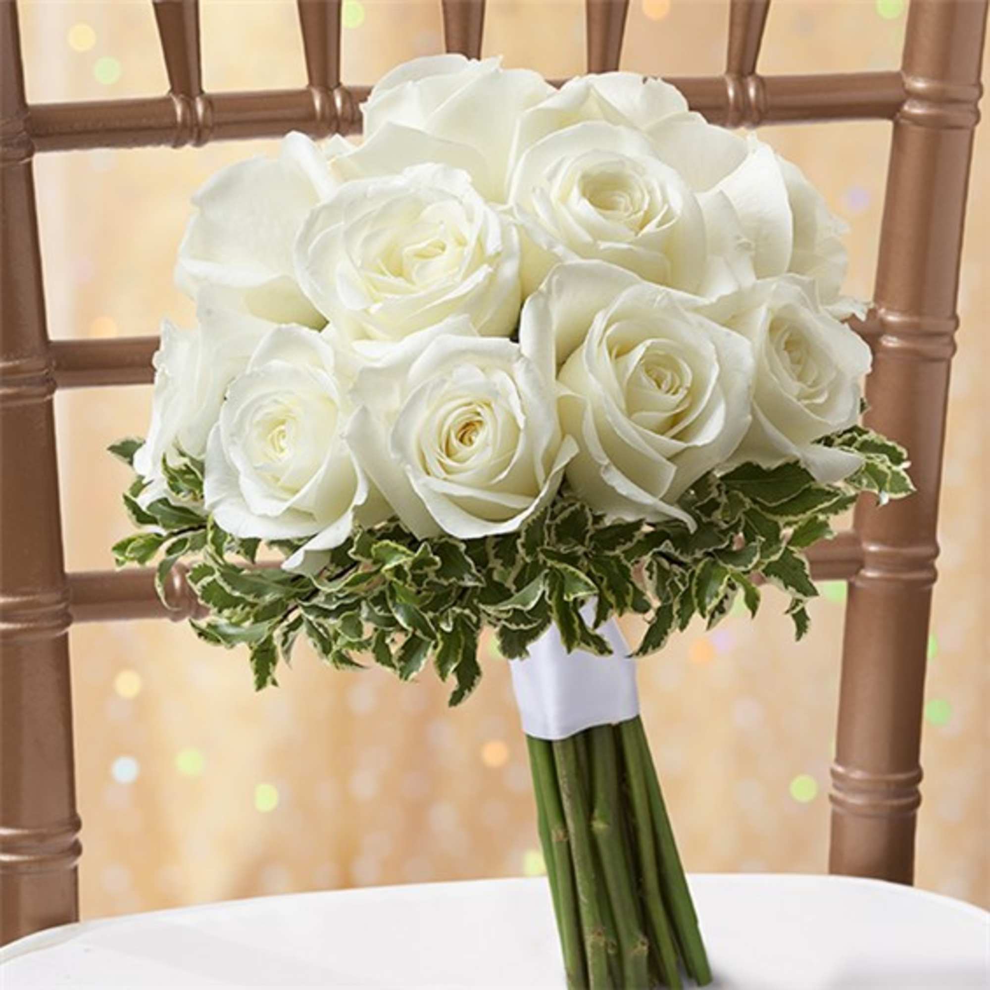 White rose bridal bouquet with variegated greenery