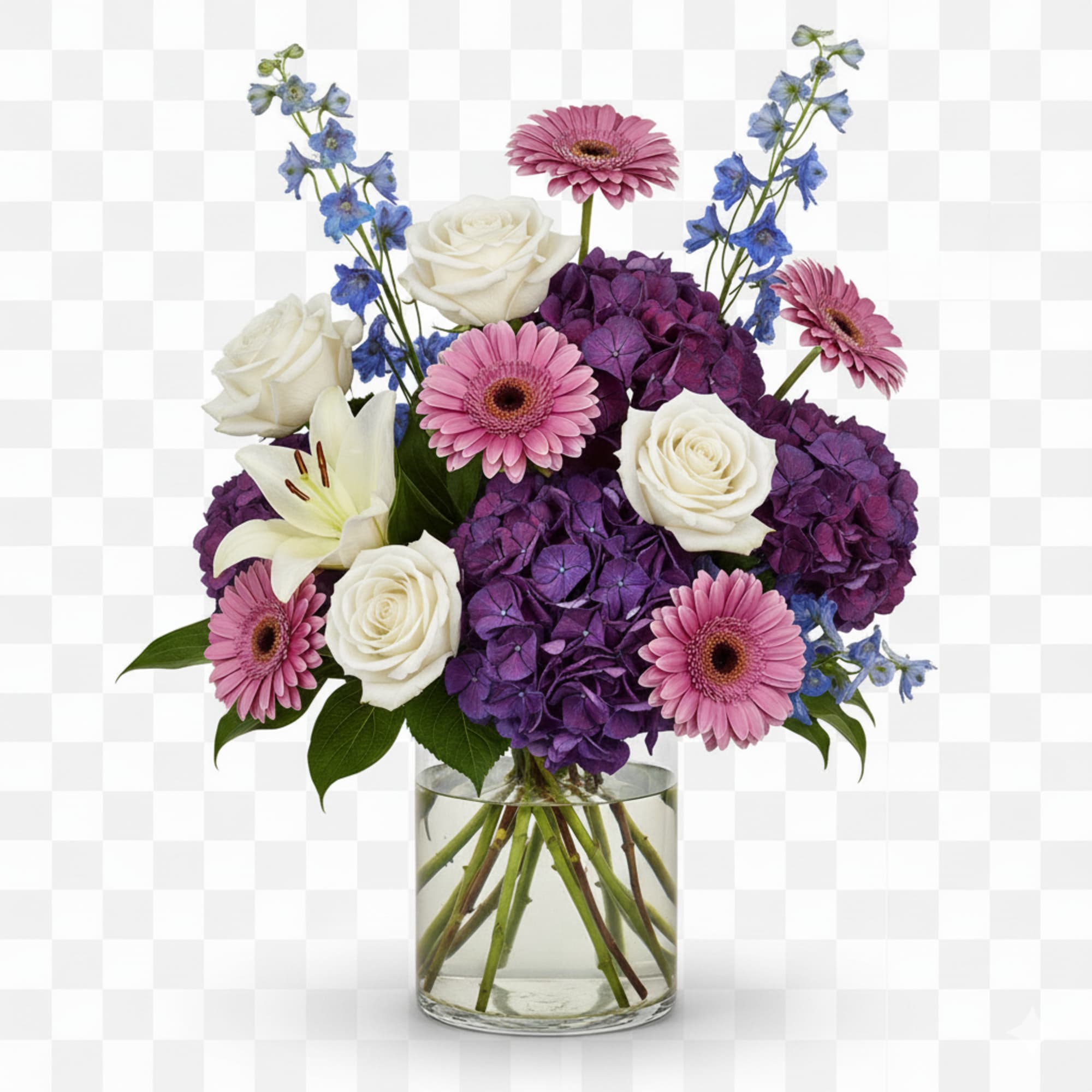 Bouquet of white roses, pink gerbera daisies, purple hydrangeas, and blue delphinium in a glass vase