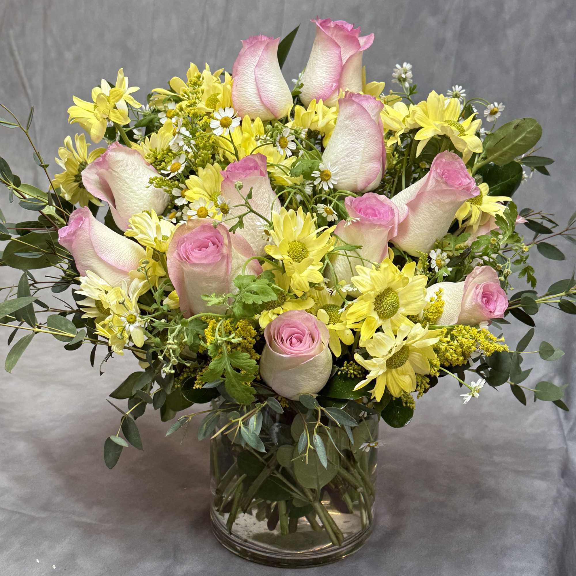 A fresh and charming mix of blush pink blooms and vibrant lime