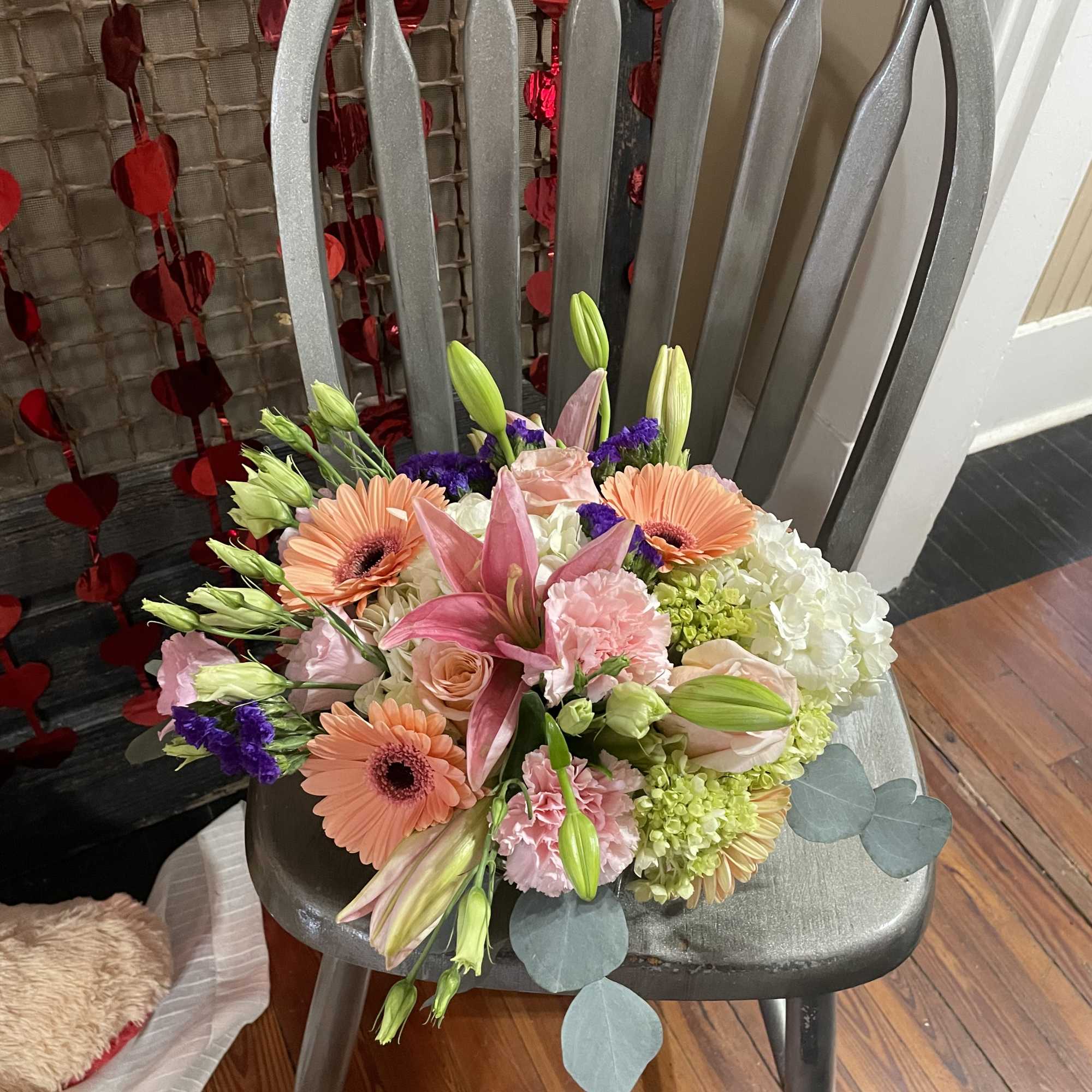 Mixed bouquet with pink lilies, peach gerbera daisies, and white hydrangeas