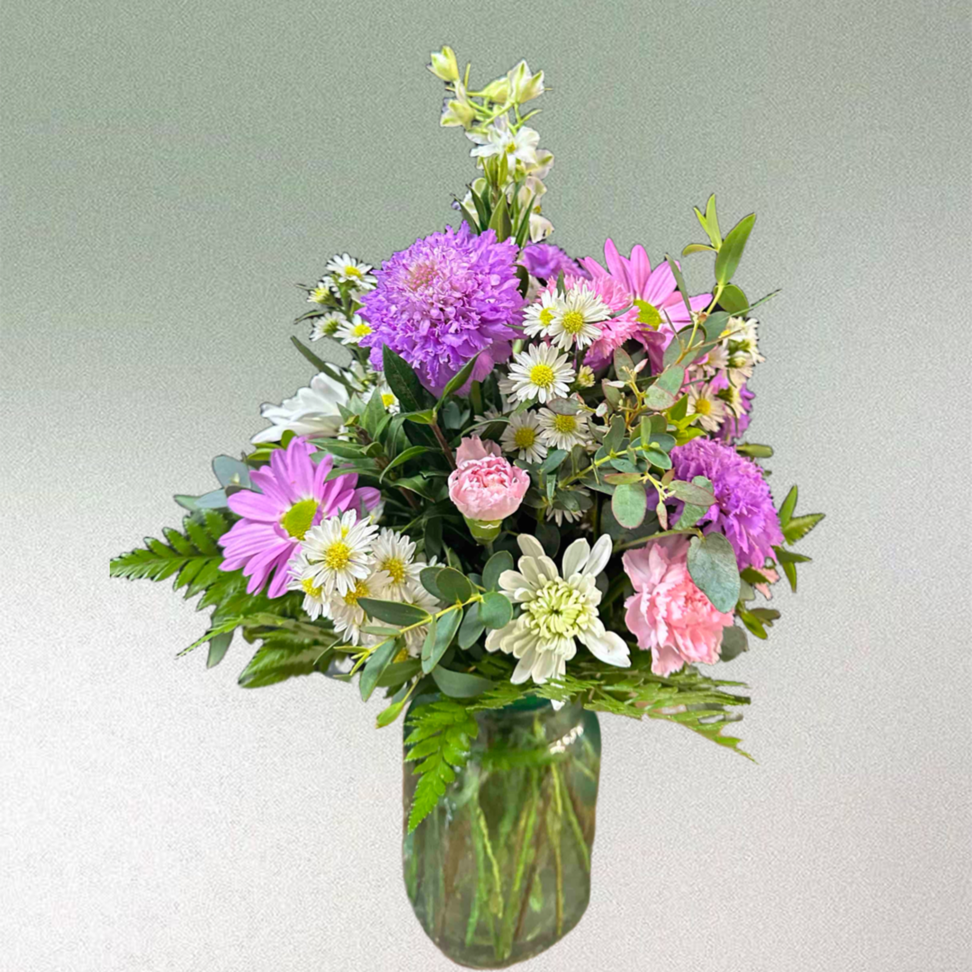Purple and pink flowers in a mason jar style vase, photo 2 of 2