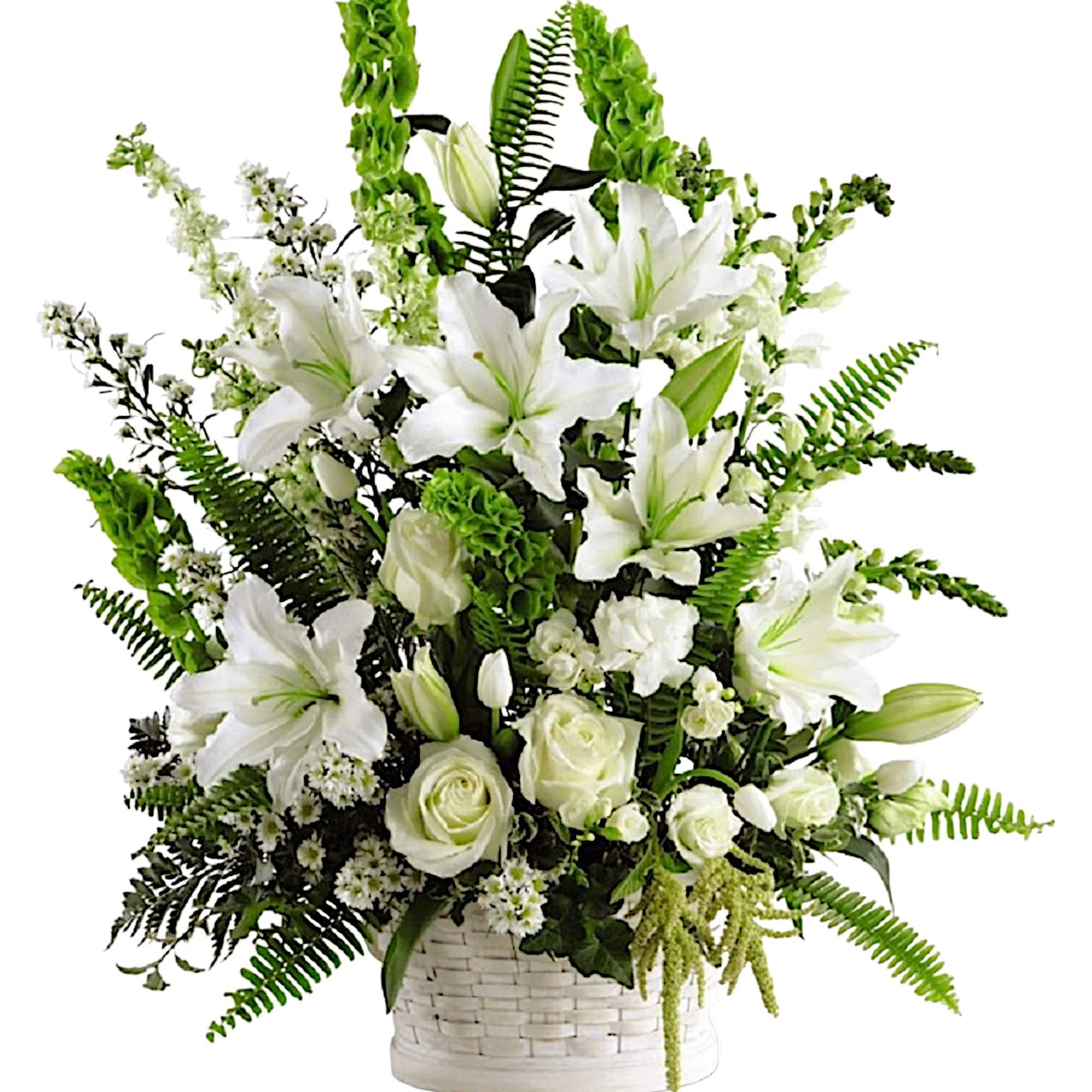 White lilies and roses in a white basket with green foliage