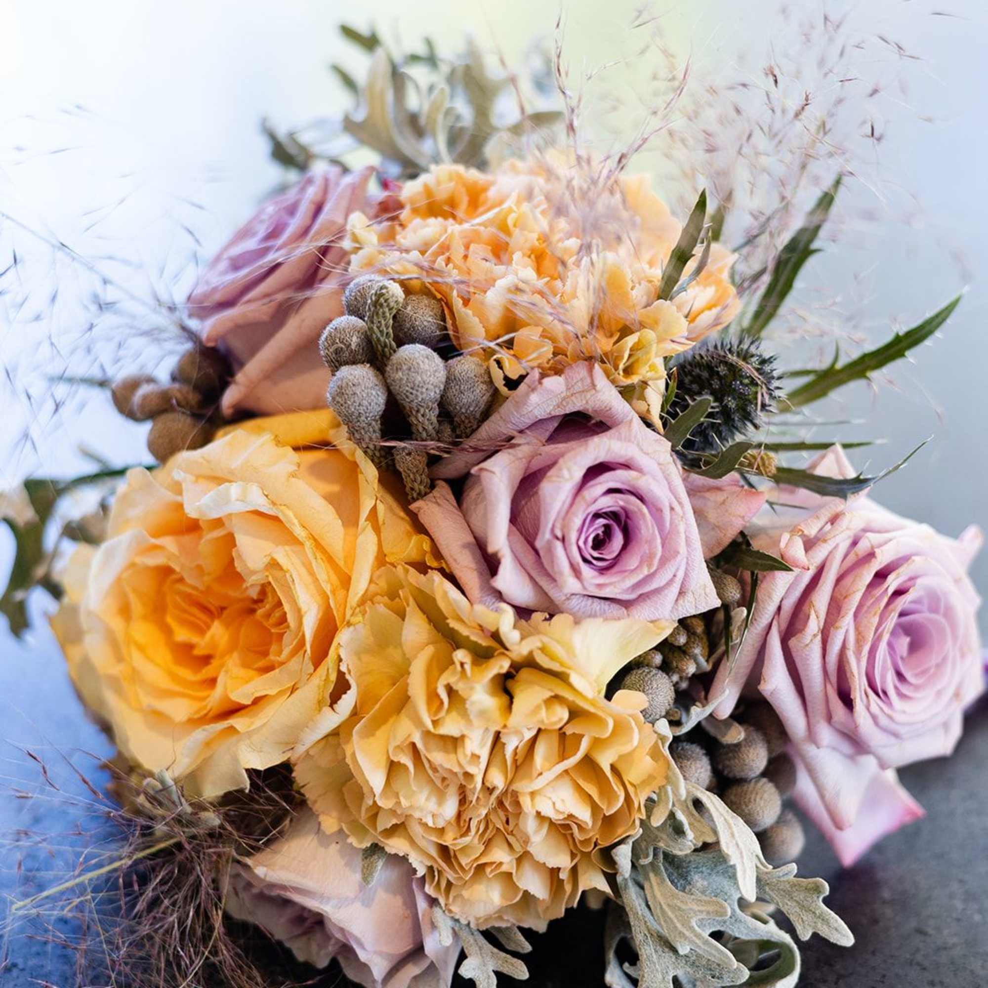 "Hand-crafted by accredited Master Florist Tricia Won (AIFD, EMC, IMF) using premium