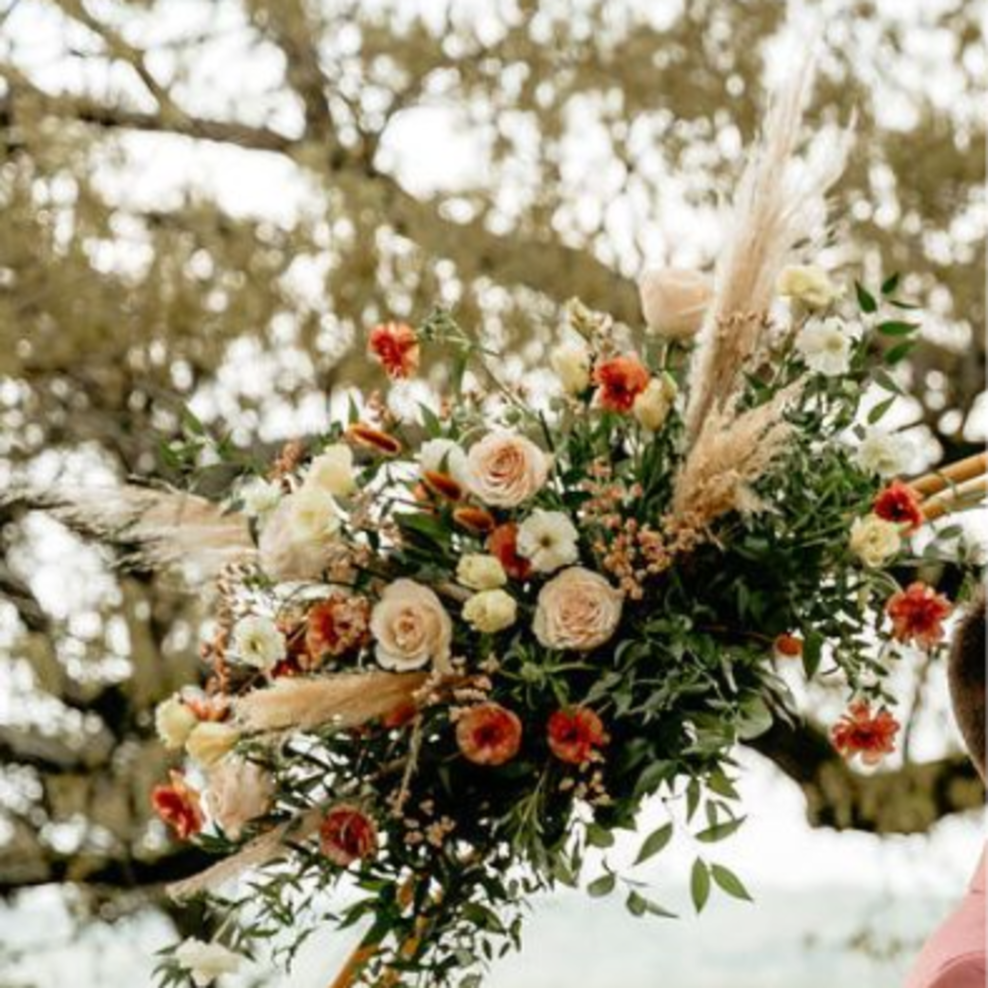 The Classic Crescent
An elegant, beautifully curated focal arrangement designed to frame your