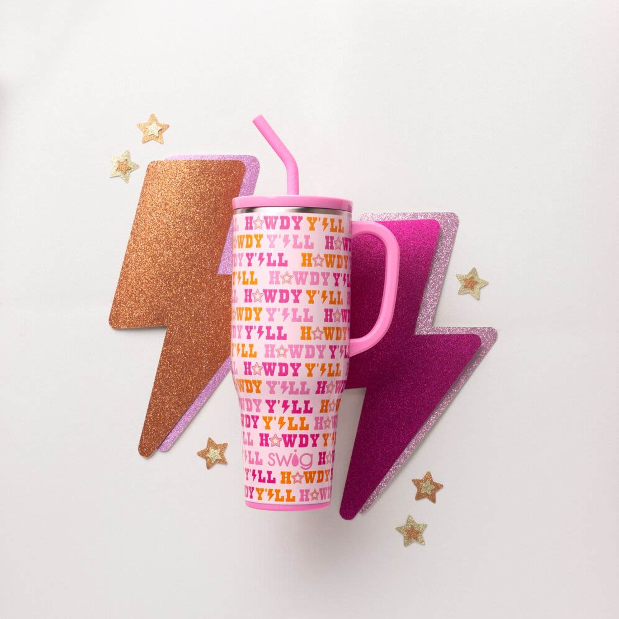 Pink handled tumbler with straw and glitter lightning bolt decorations