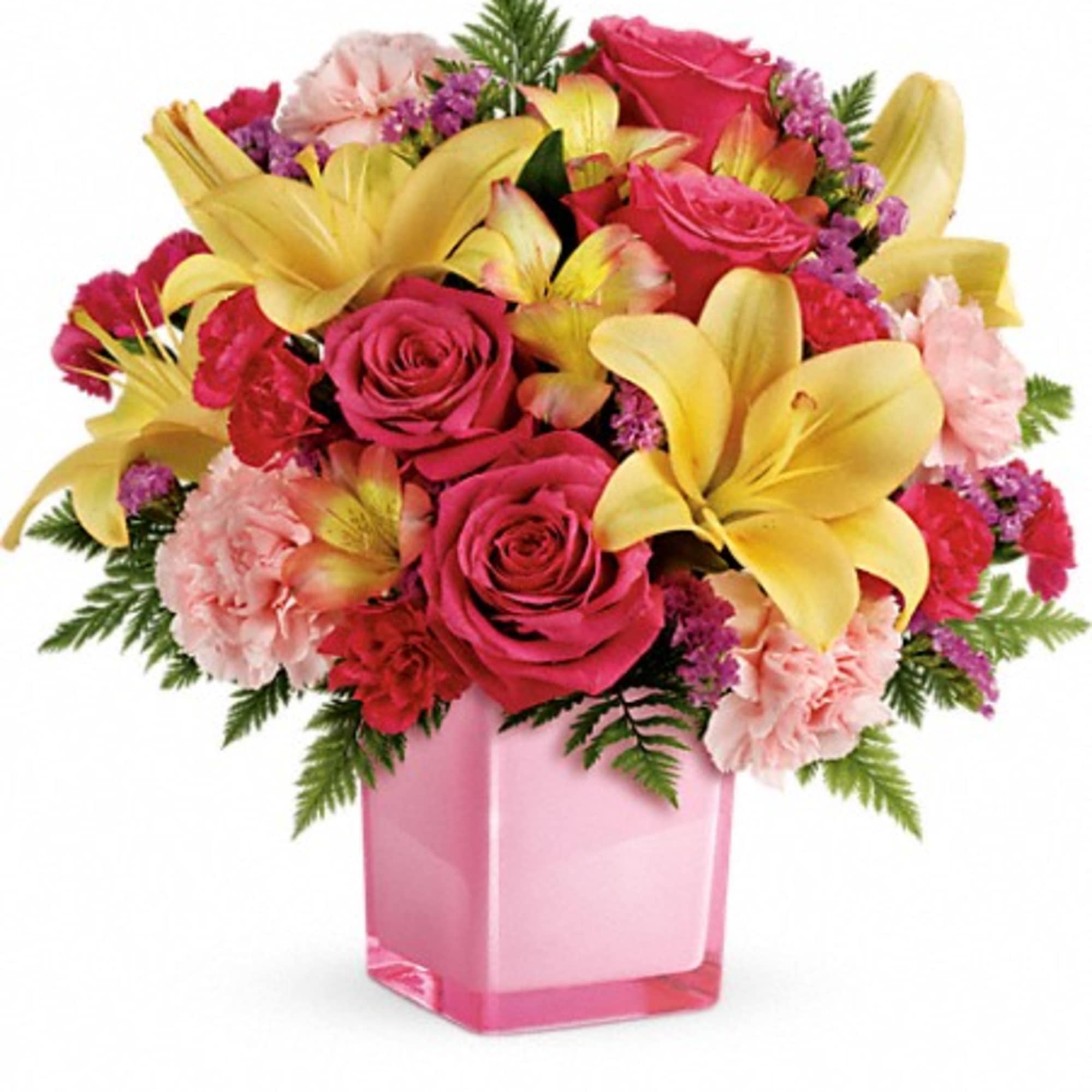 Pink roses and yellow lilies in a pink glass vase