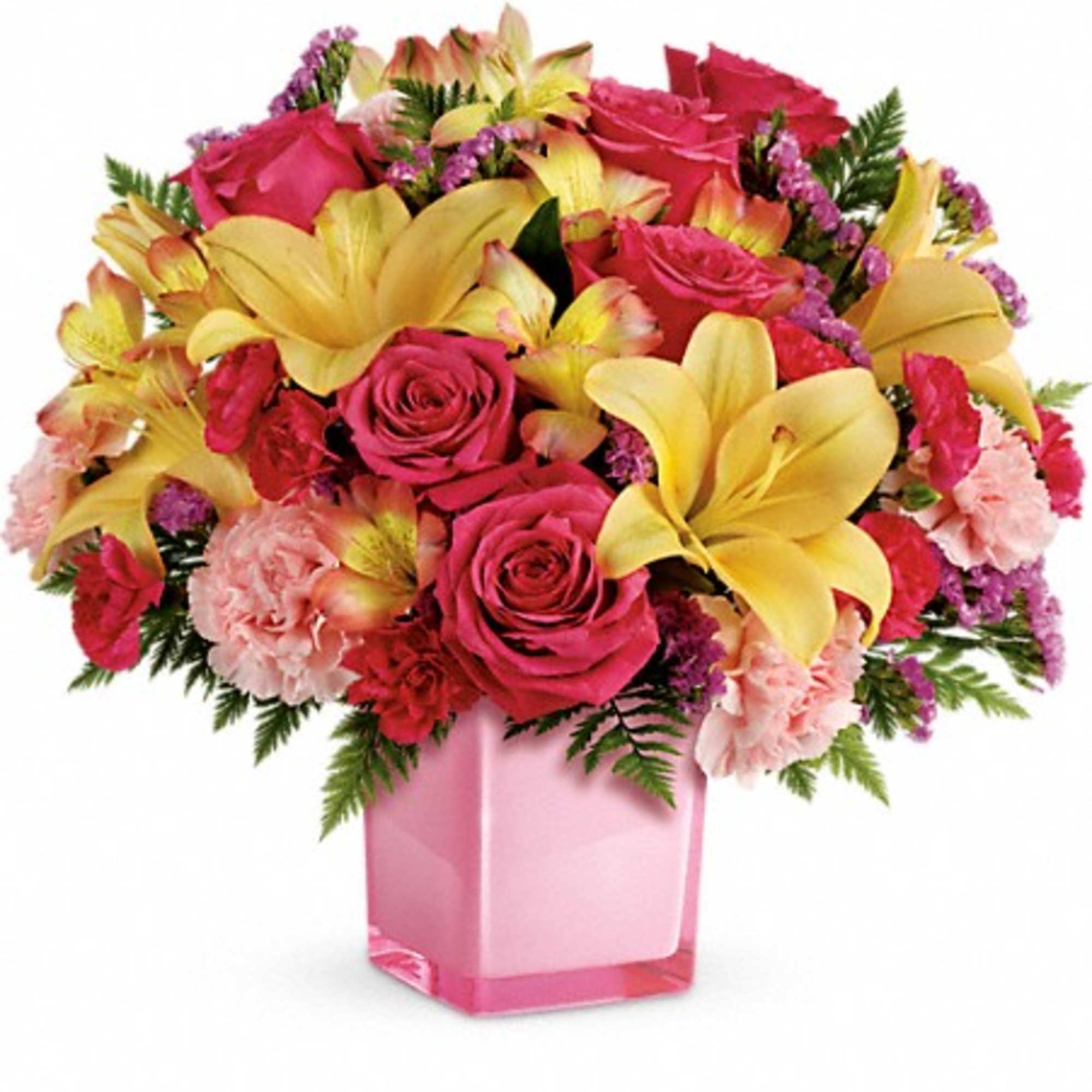 Bouquet of pink roses, yellow lilies, and carnations in a pink vase