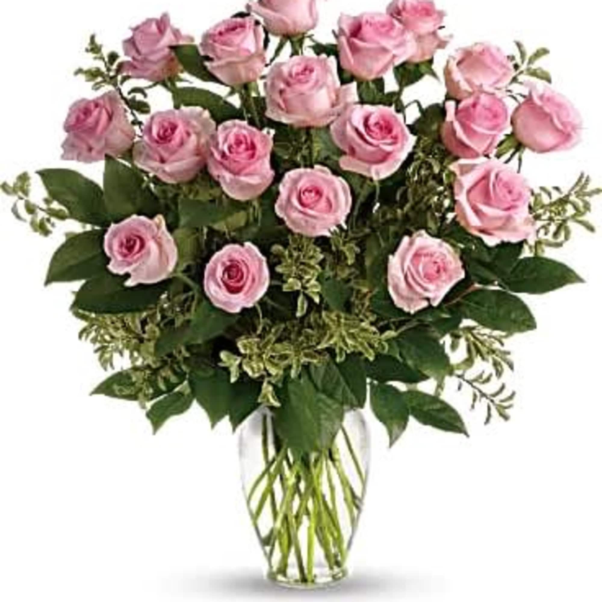Pink roses arranged in a clear glass vase, photo 2 of 3