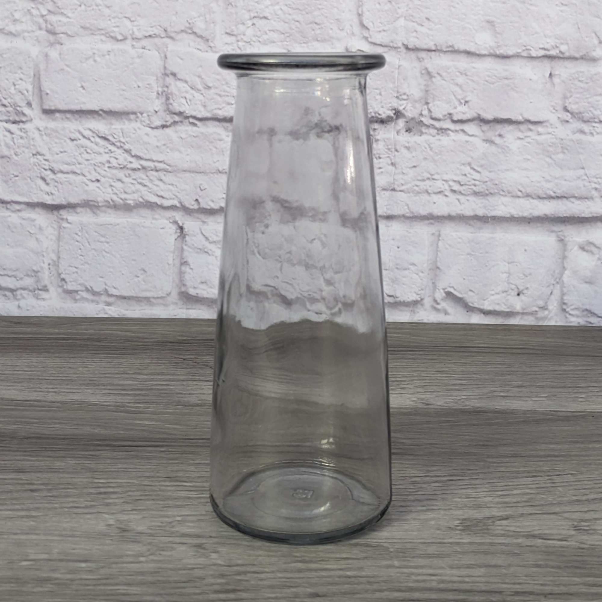 Clear glass vase on a wooden surface