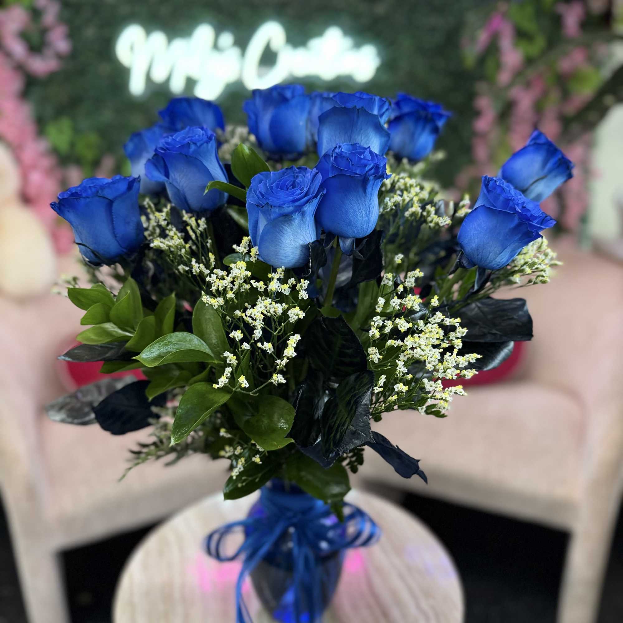 Bouquet of vivid blue roses with small white filler flowers, photo 4 of 4