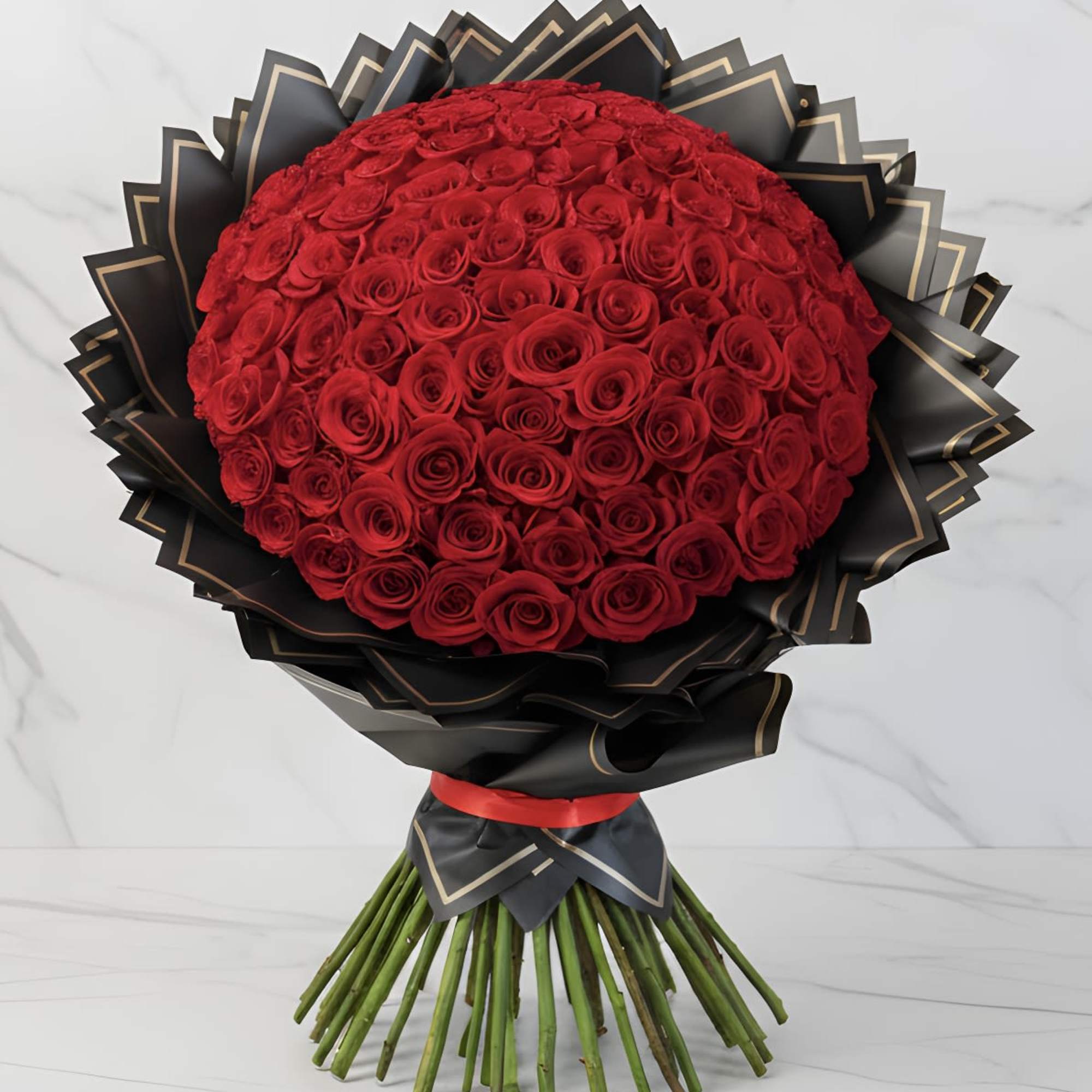 Large bouquet of red roses wrapped in black paper with gold trim