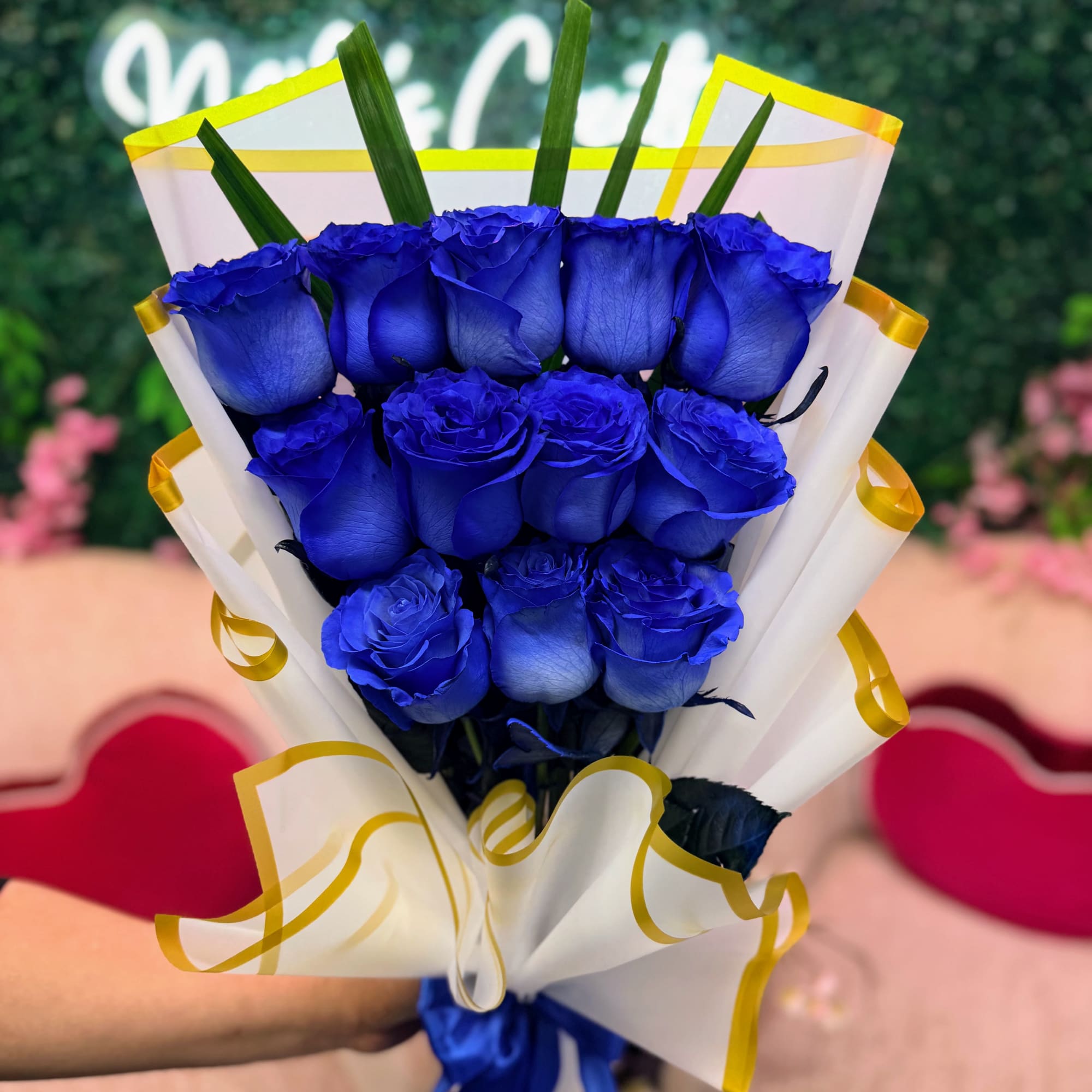 A captivating arrangement of fresh blue roses, elegantly wrapped and tied with, photo 2 of 2
