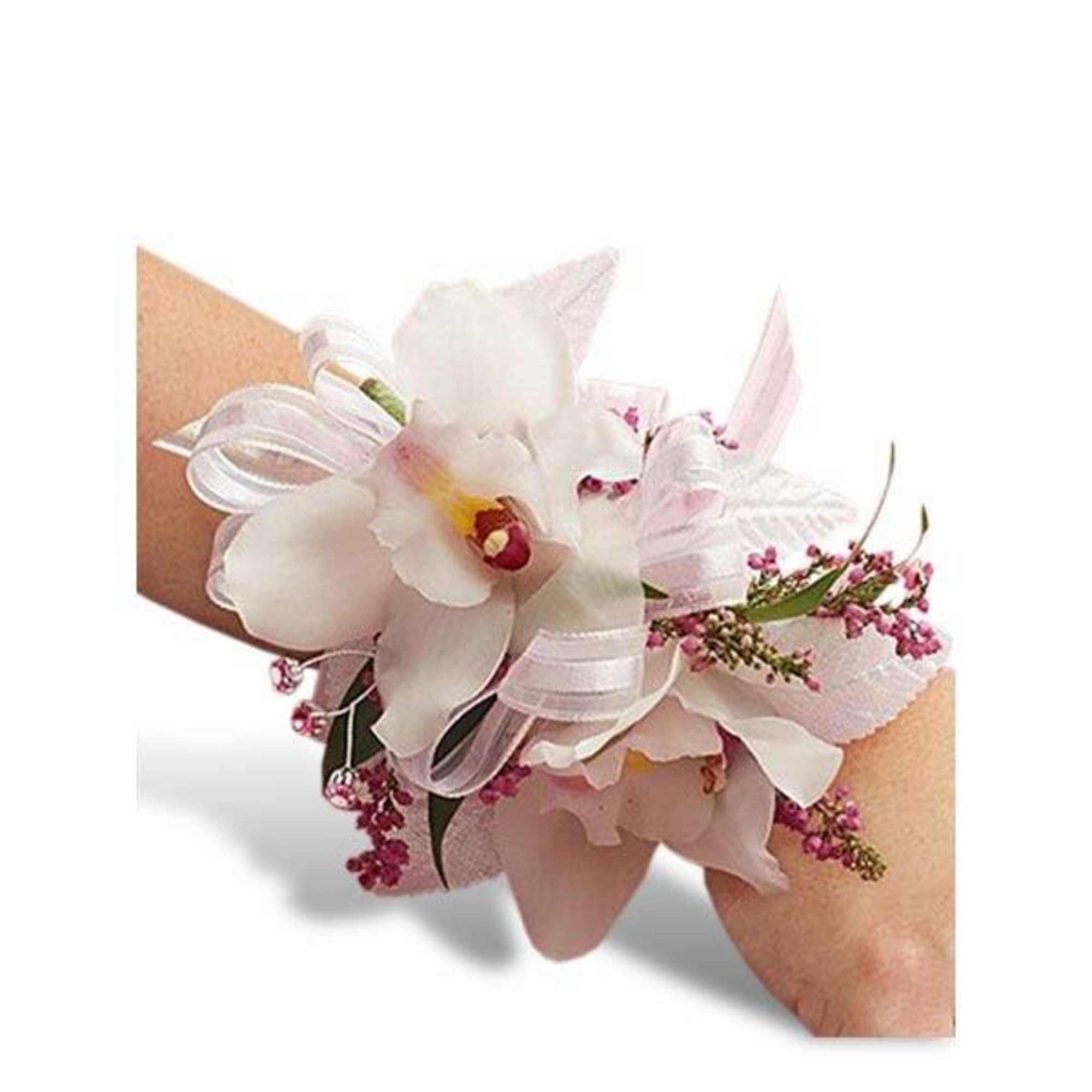 White orchid wrist corsage with pink accents and ribbon on a wristband