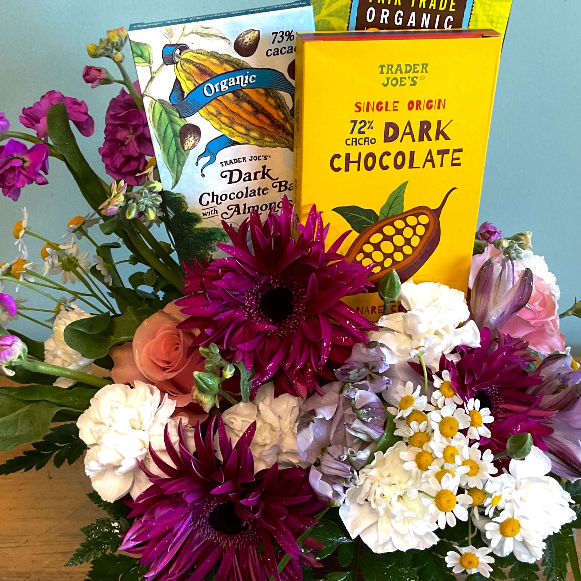 Sunshine-bright gerbera daisies and soft pink alstroemeria make this mixed-color flower arrangement