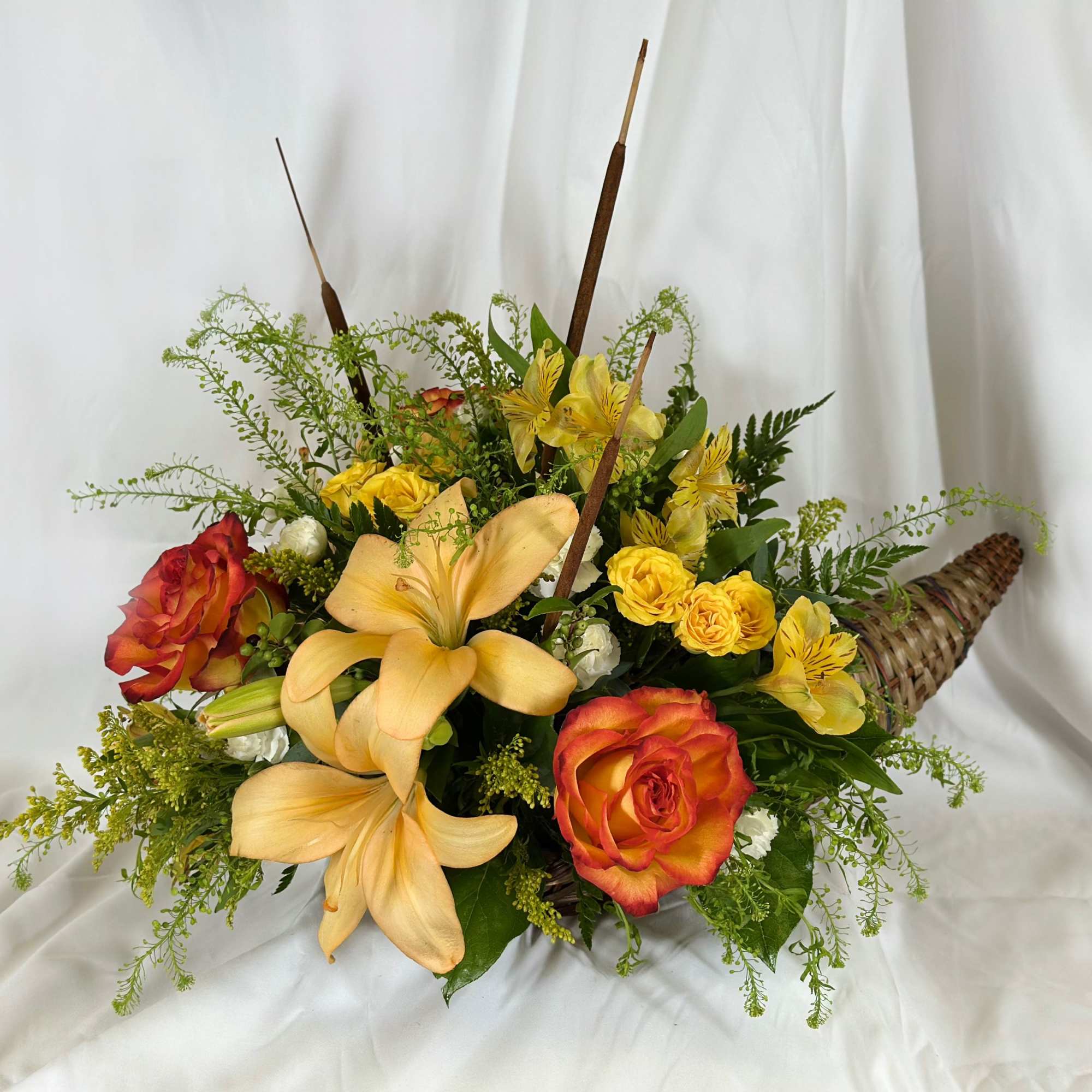 This beautiful Fall arrangement will look stunning with roses, snapdragons,  and