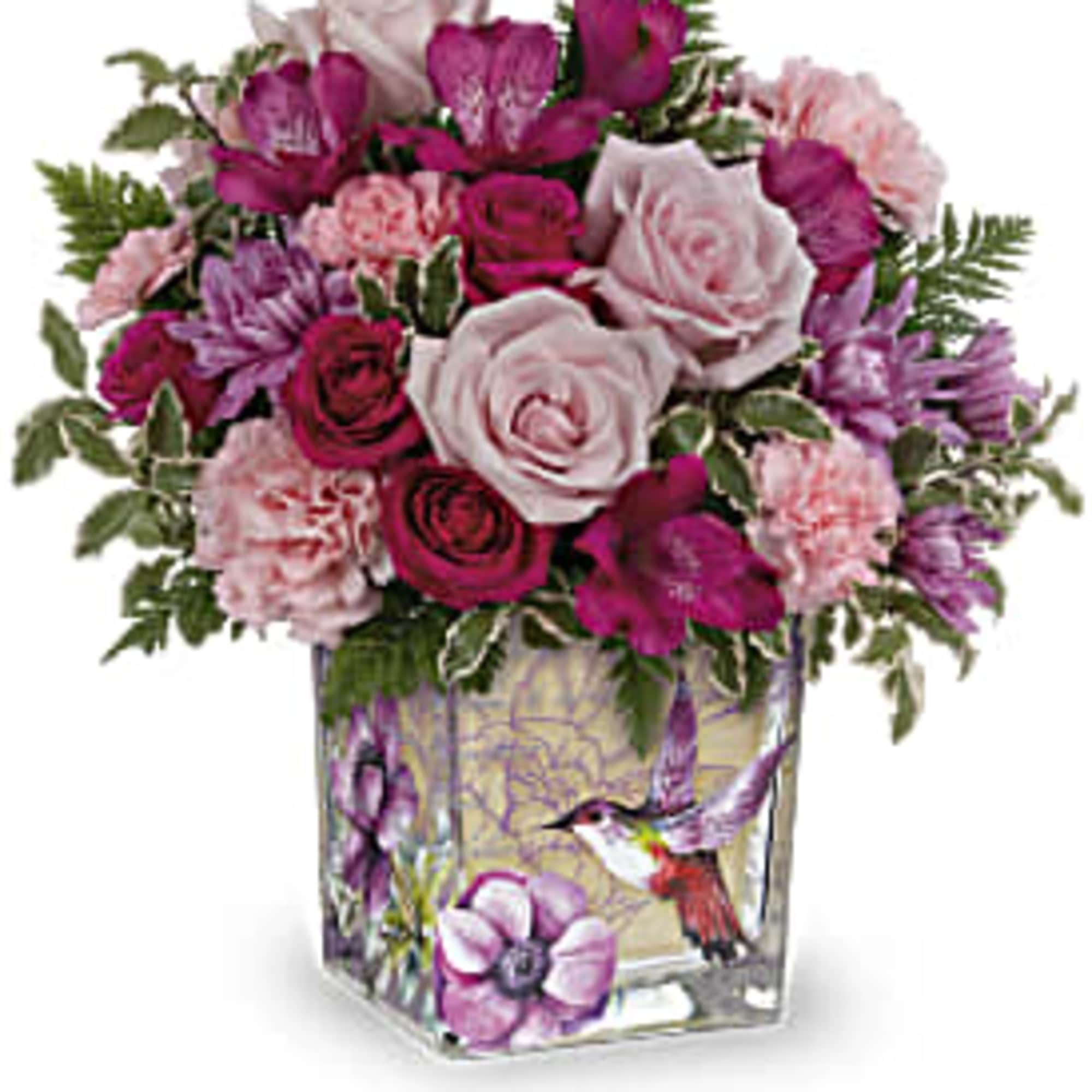 Pink and purple rose bouquet in a decorated glass vase