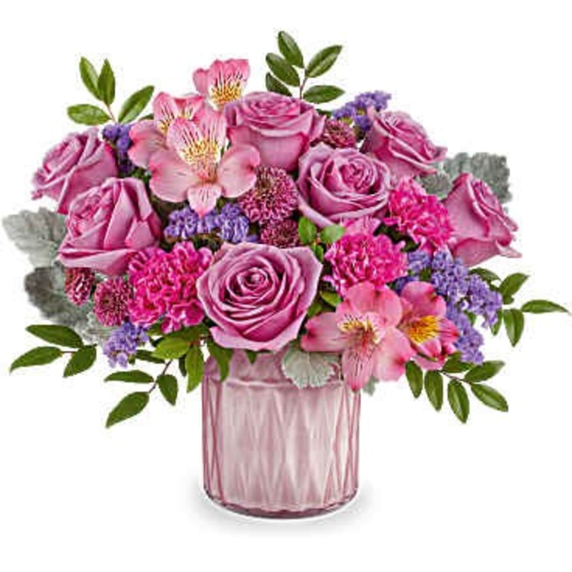 Pink roses and alstroemeria in a pink glass vase