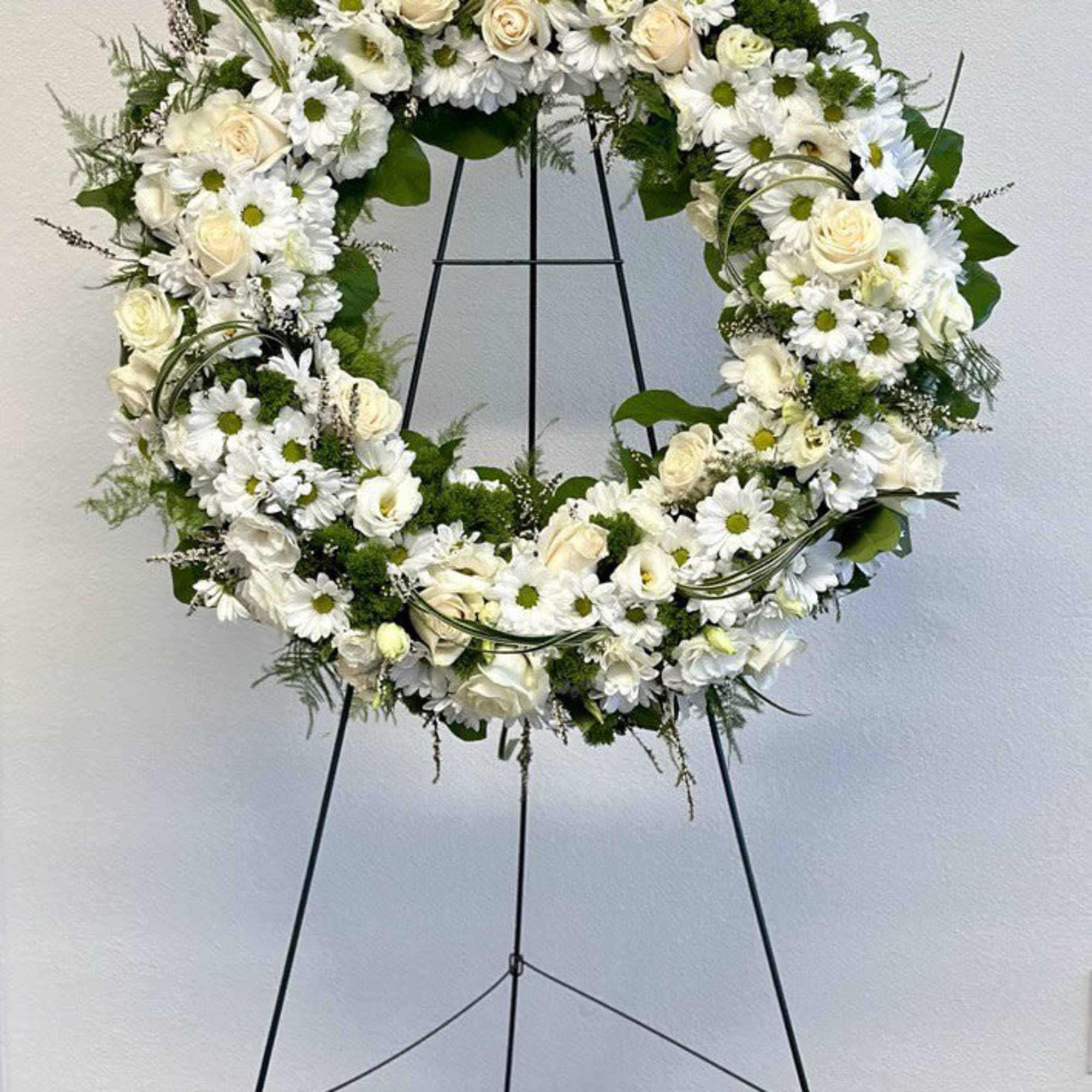 A beautiful white and green tribute wreath that calms, this easel arrangement, photo 2 of 3