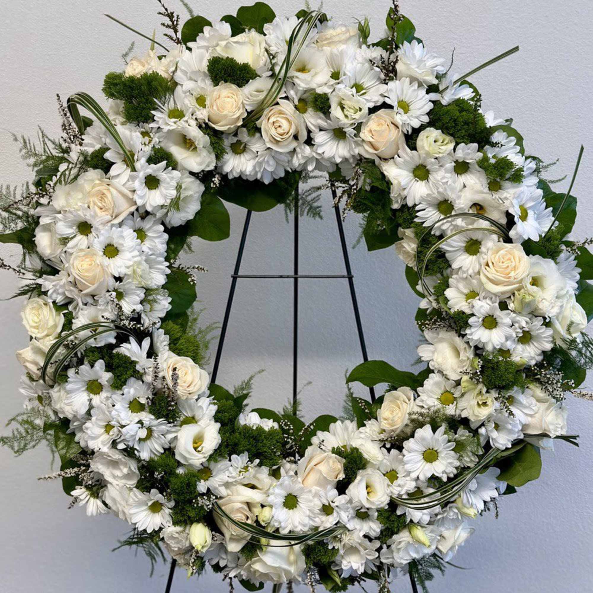 A beautiful white and green tribute wreath that calms, this easel arrangement, photo 3 of 3