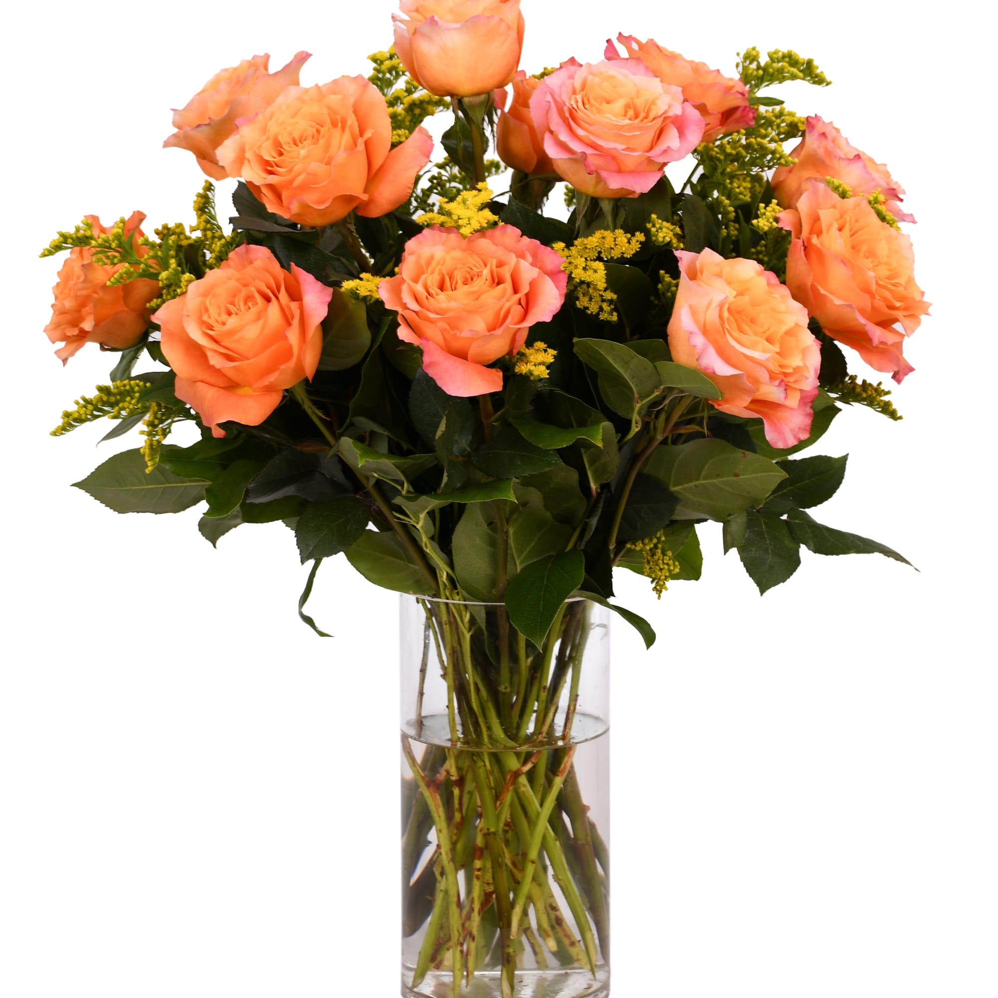 Orange roses in a clear glass vase with yellow filler flowers