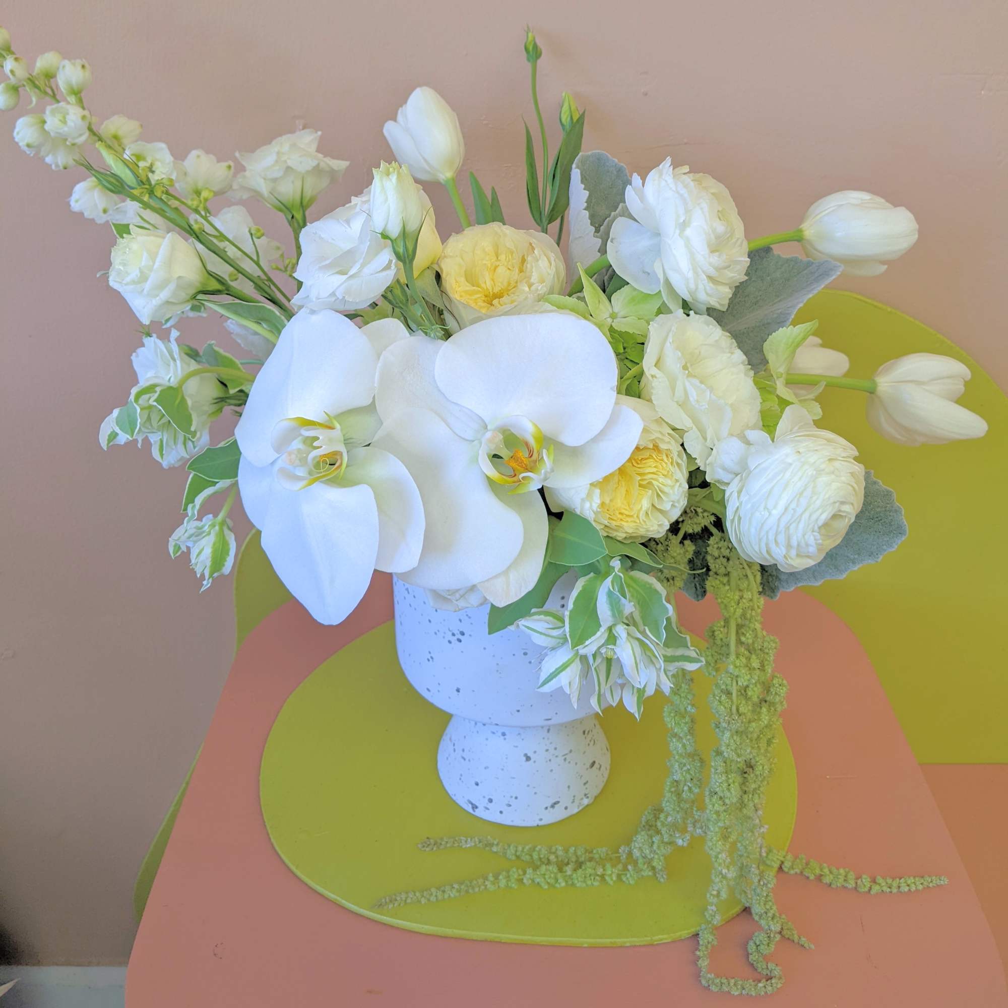 A fresh all white arrangement including garden roses and orchids comes in, photo 2 of 2