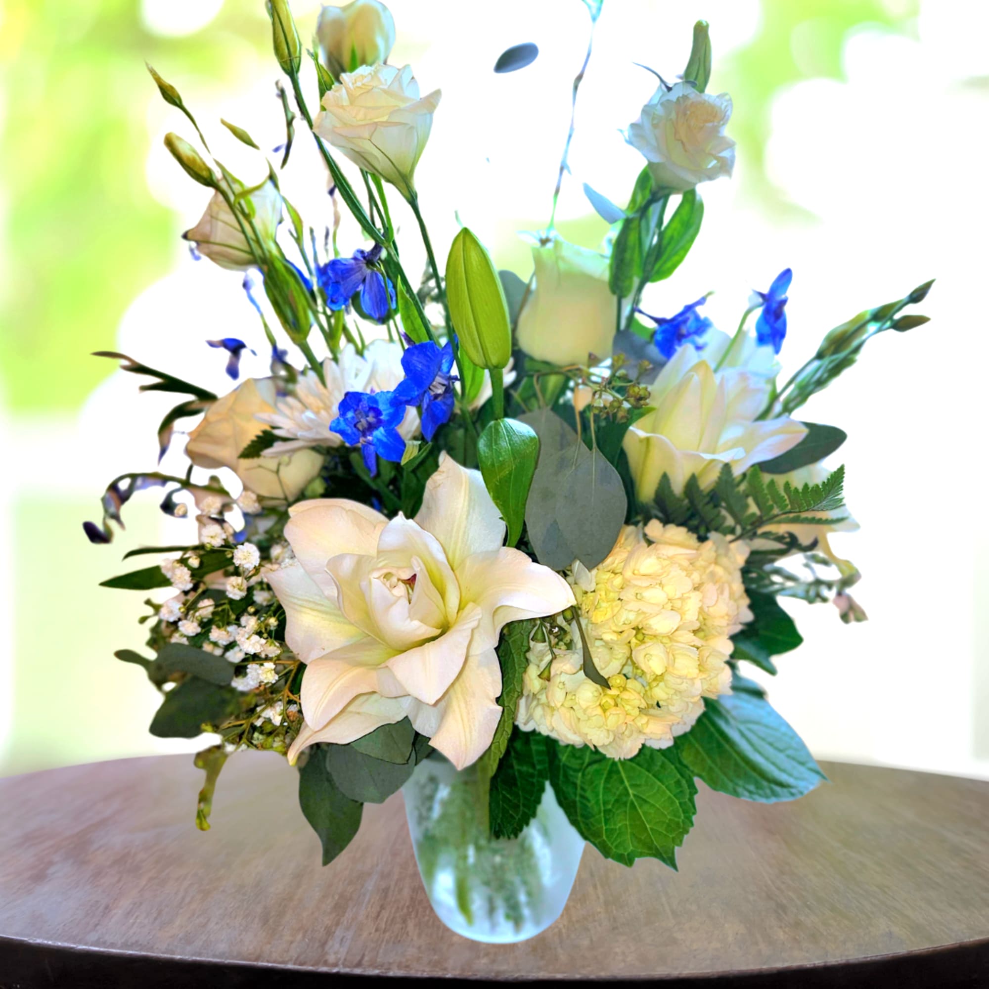 A breathtaking arrangement that captures the essence of serenity and elegance, The