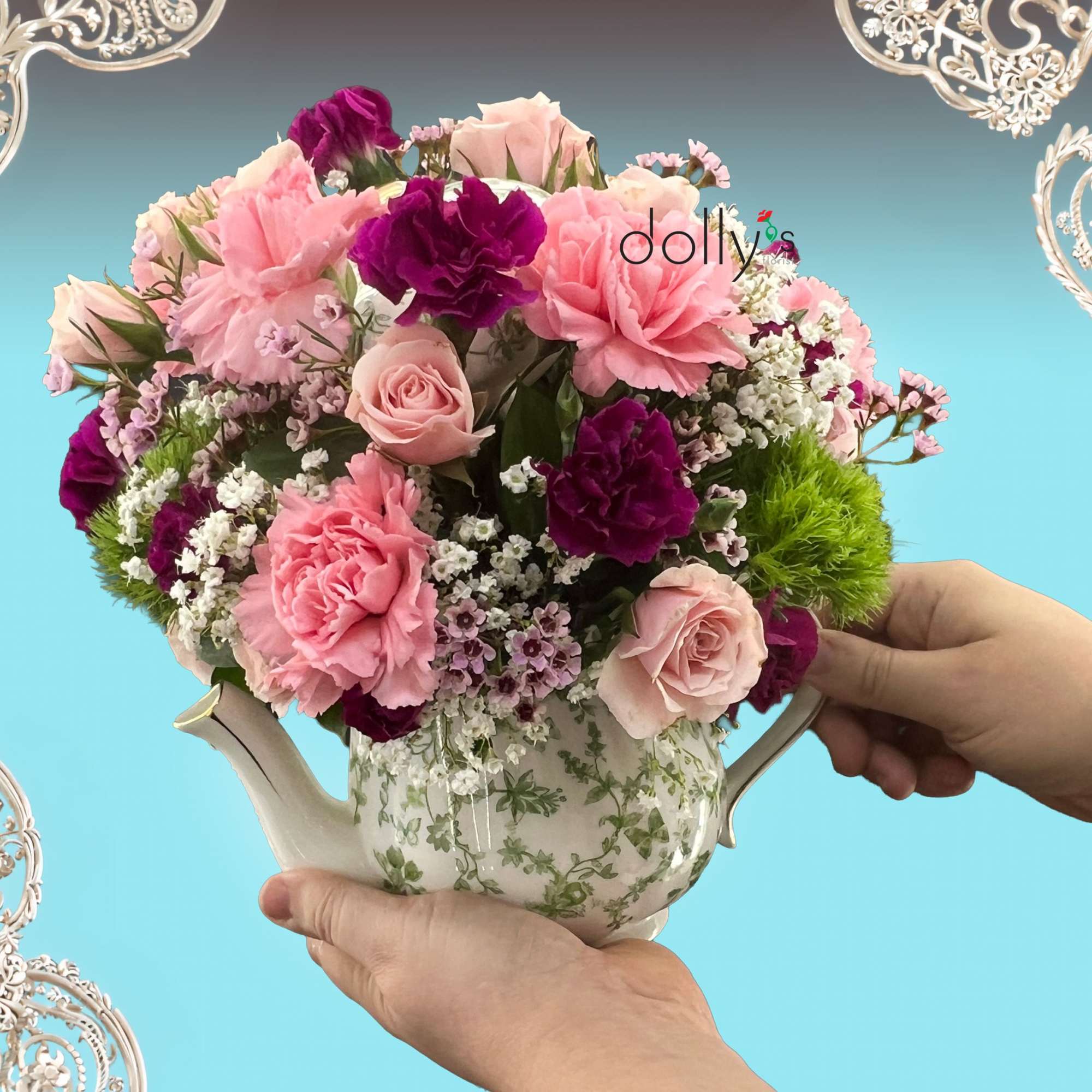 A dense, rounded cluster of blush and deep purple blooms arranged in