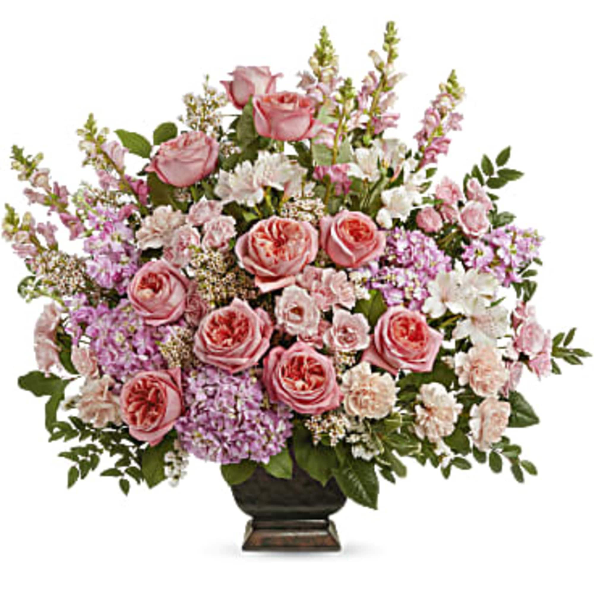 Pink roses and mixed pastel flowers arranged in a dark vase