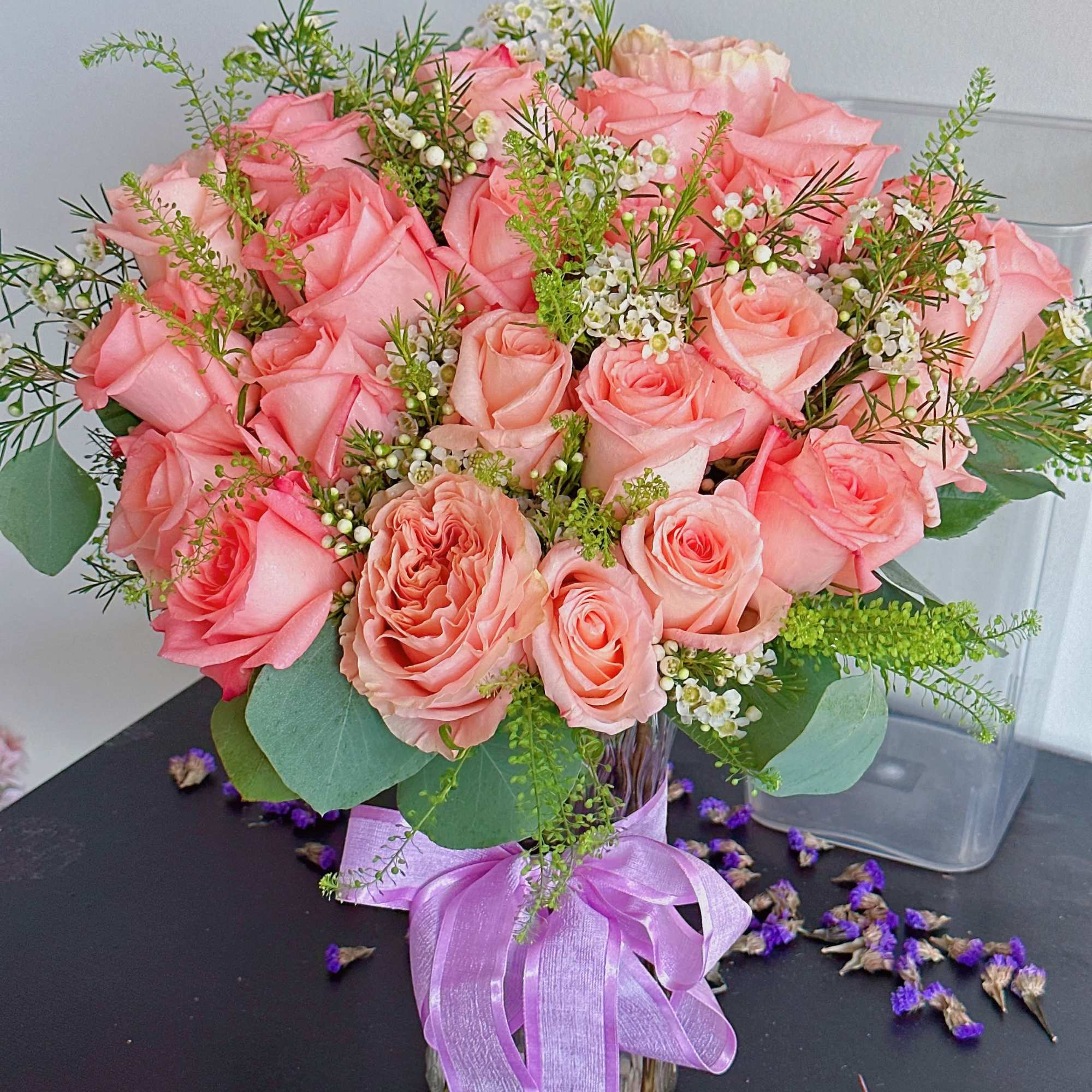 Pink rose bouquet in a glass vase with a lavender ribbon, photo 3 of 4