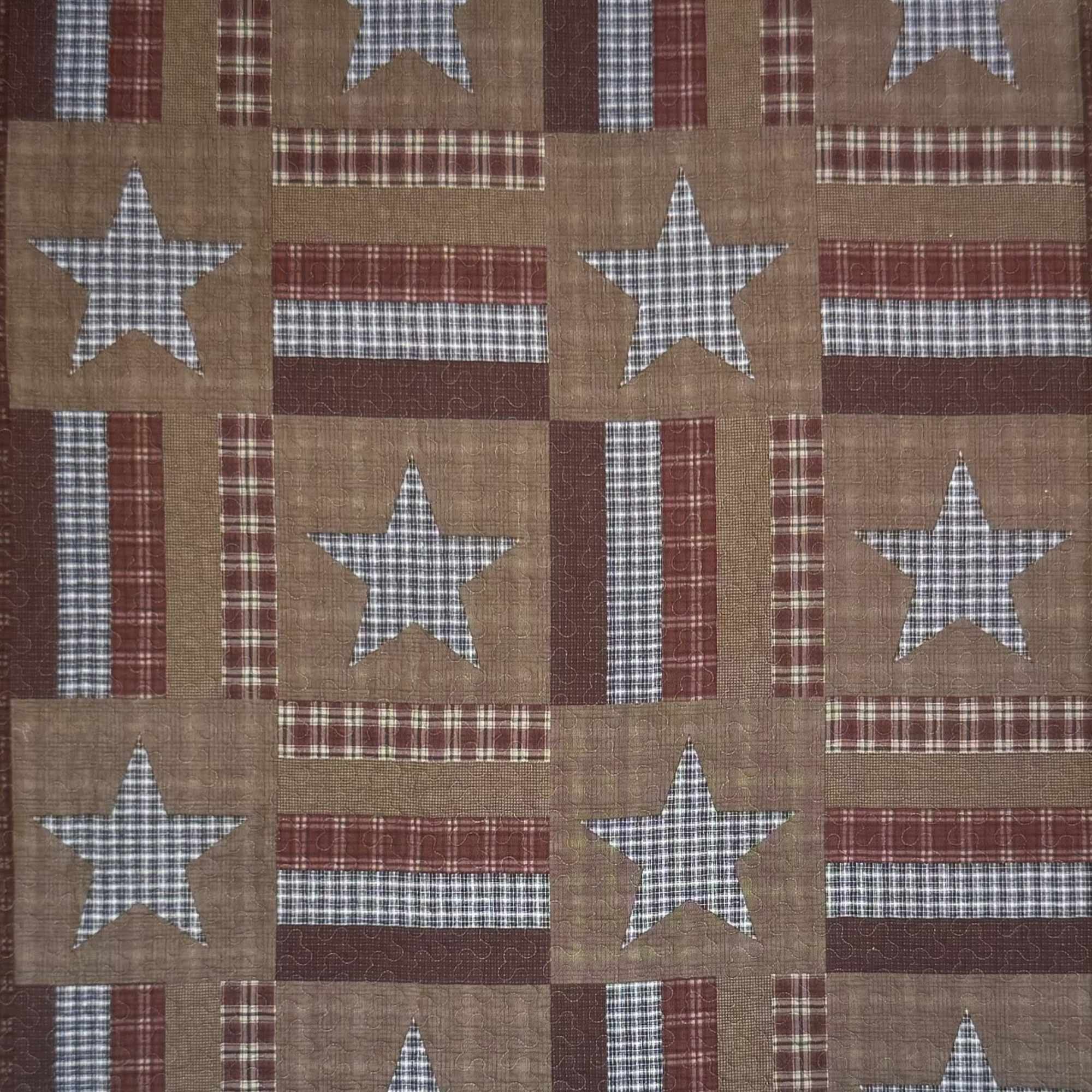 Patchwork quilt with stars and plaid squares in red, tan, and blue