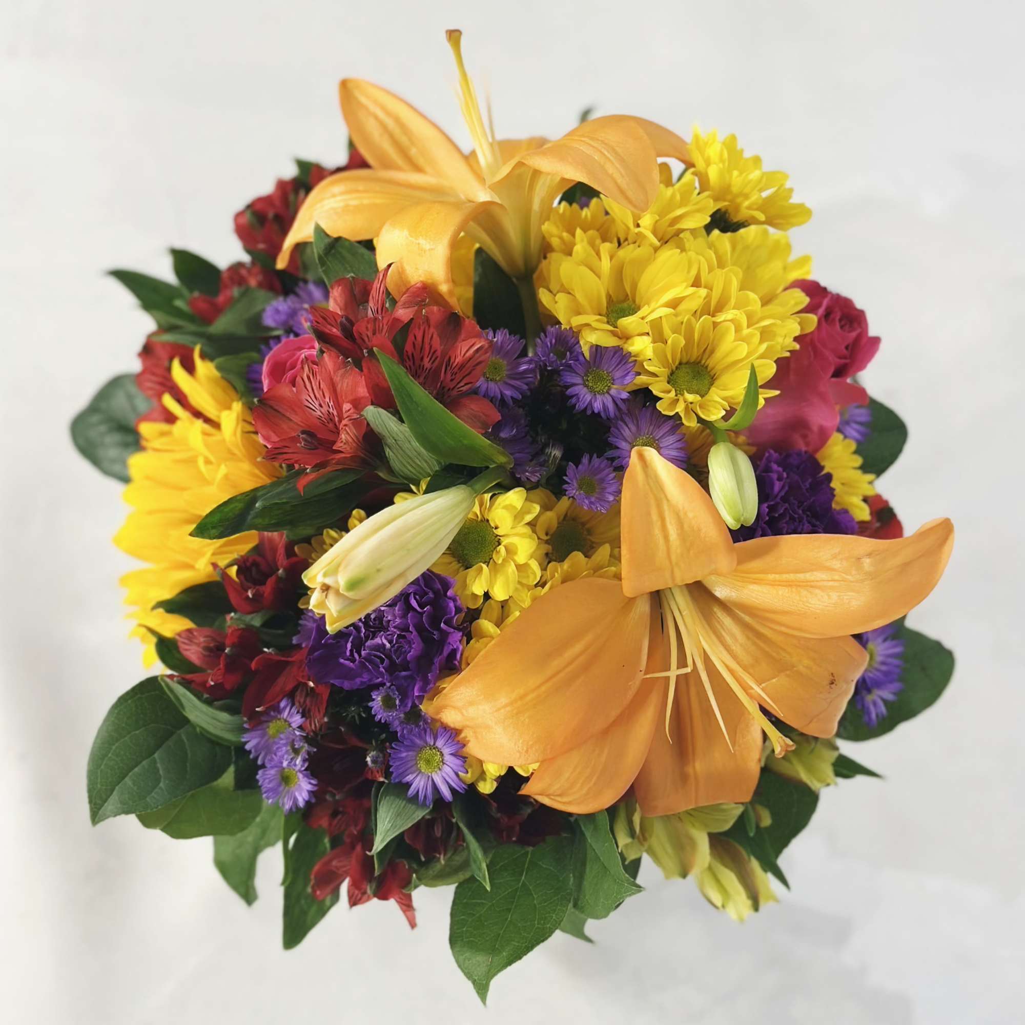 The Rustic Country Garden is an eye-catching, vibrant floral arrangement that is