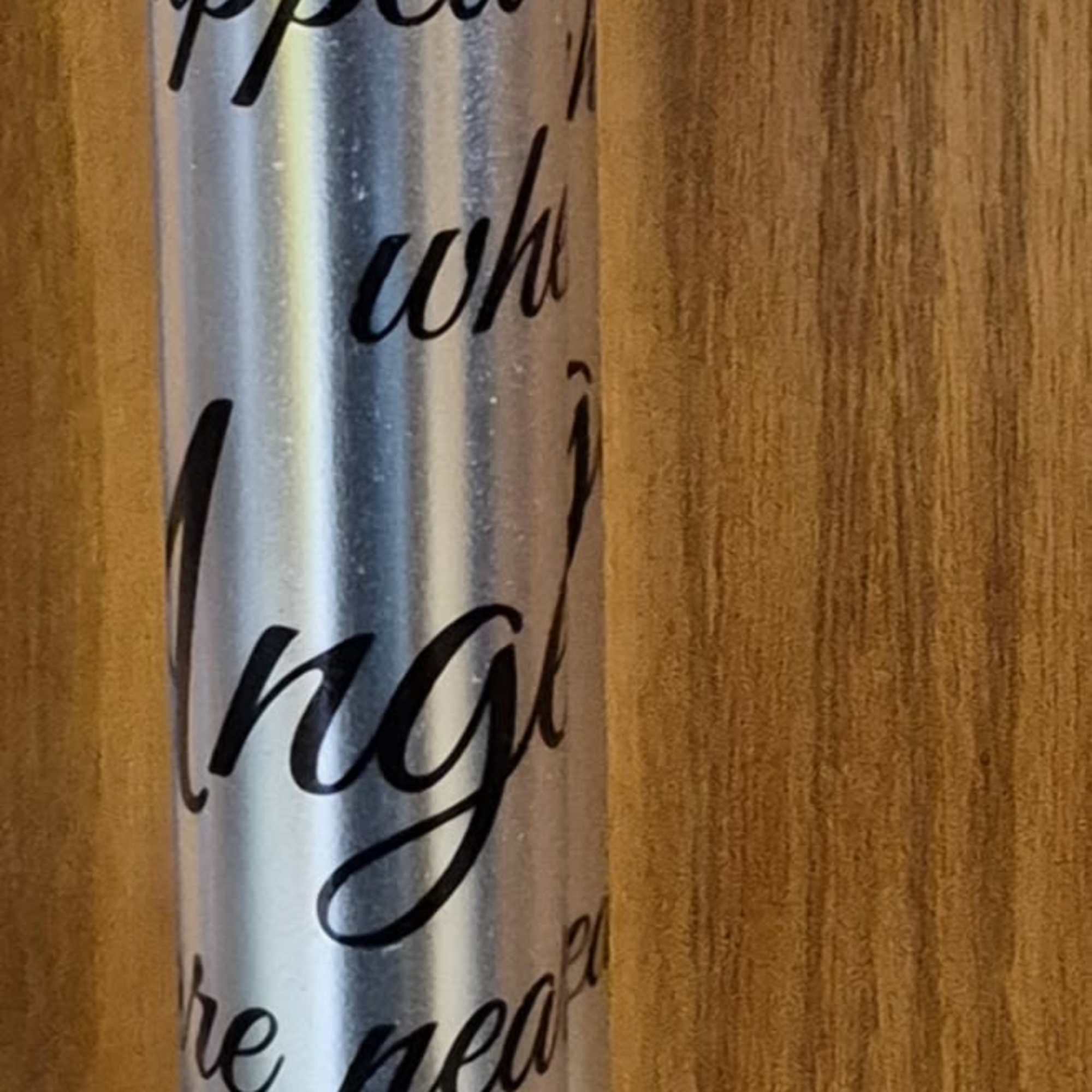 Tall silver wind chime tube with red cardinal illustration and cursive memorial text