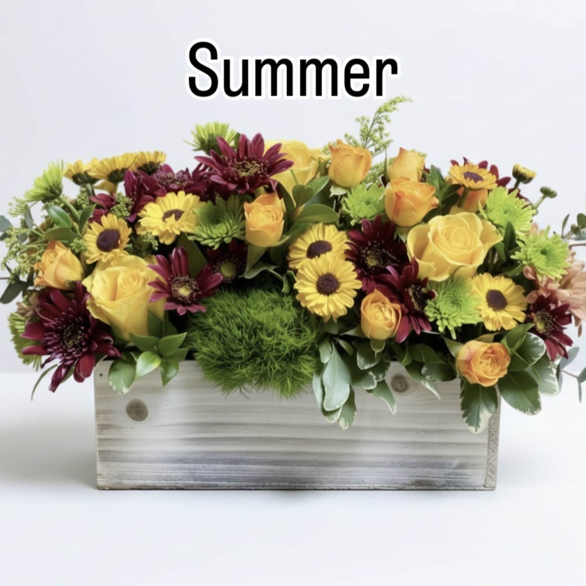 Mixed yellow and burgundy flowers arranged in a wooden box