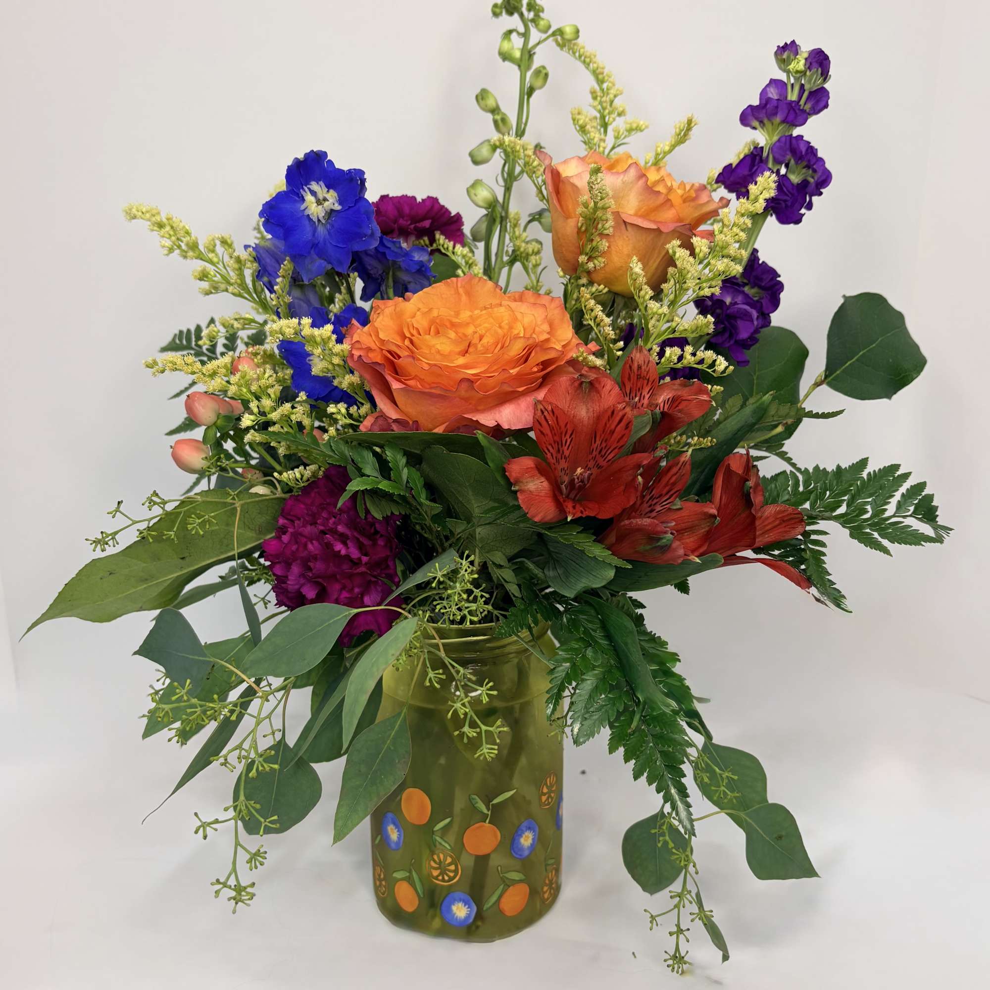 Fruit Punch is a delicious mix of orange roses, blue delphinium, purple, photo 2 of 2
