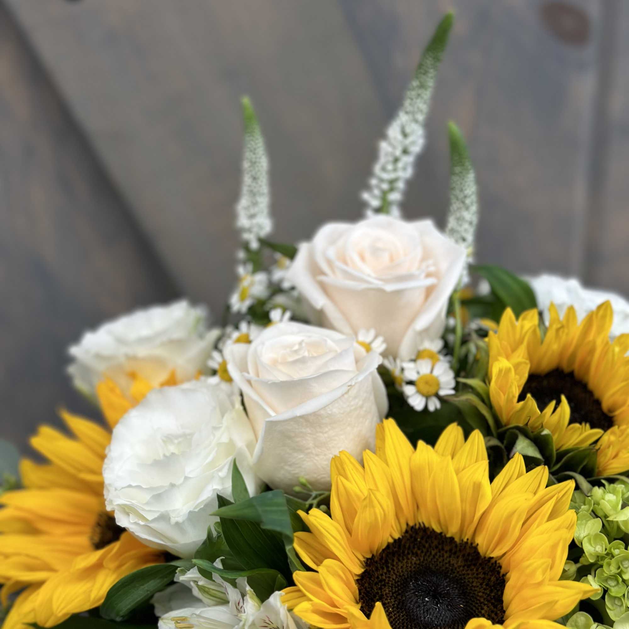 Bouquet with sunflowers, white roses, and small white daisies