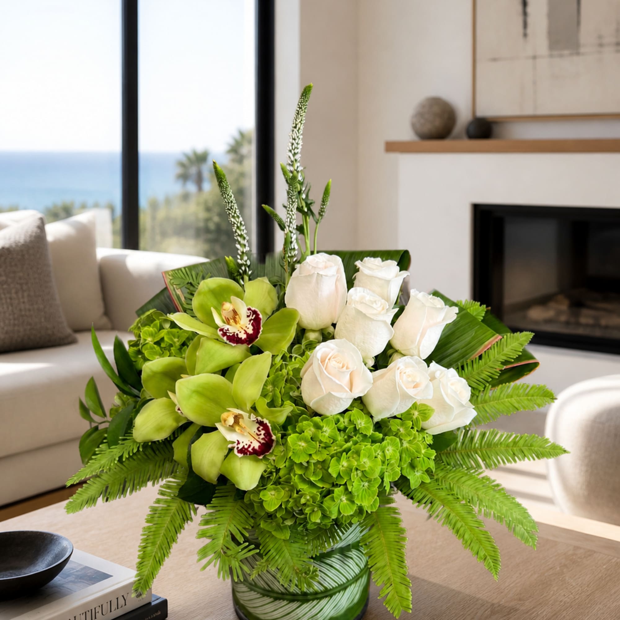 Included in this design are Roses, Hydrangea, Cymbidium Orchids, Alstroemeria, Veronica, Ti