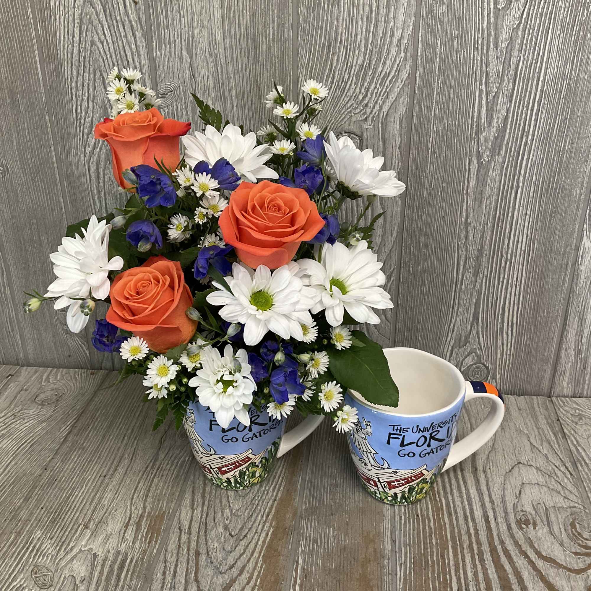 Mixed flowers in a keepsake ceramic Gator artwork mug. Flowers may vary., photo 2 of 4