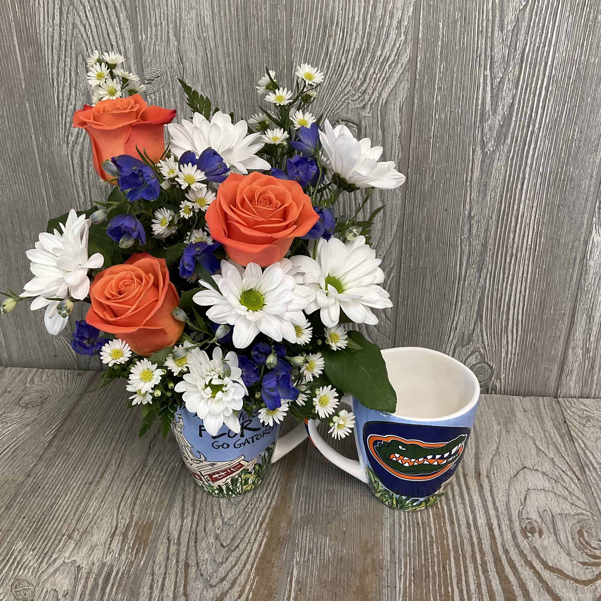 Mixed flowers in a keepsake ceramic Gator artwork mug. Flowers may vary., photo 3 of 4