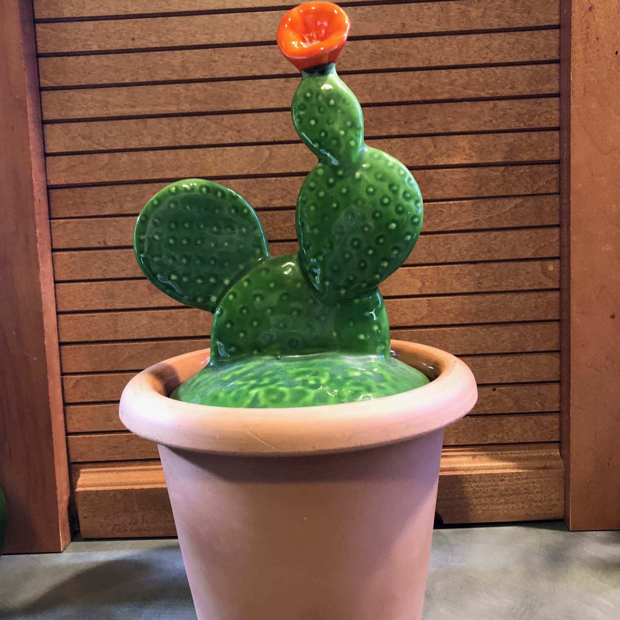 Ceramic cactus sculpture in a large pot