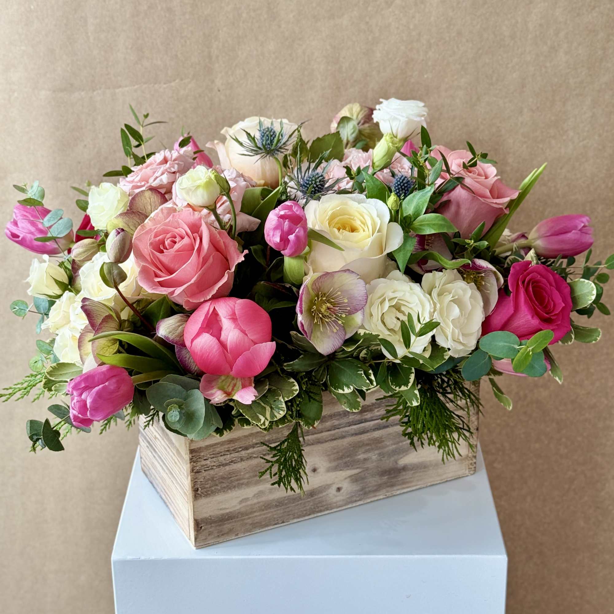 Pink and white mixed bouquet in a wooden box